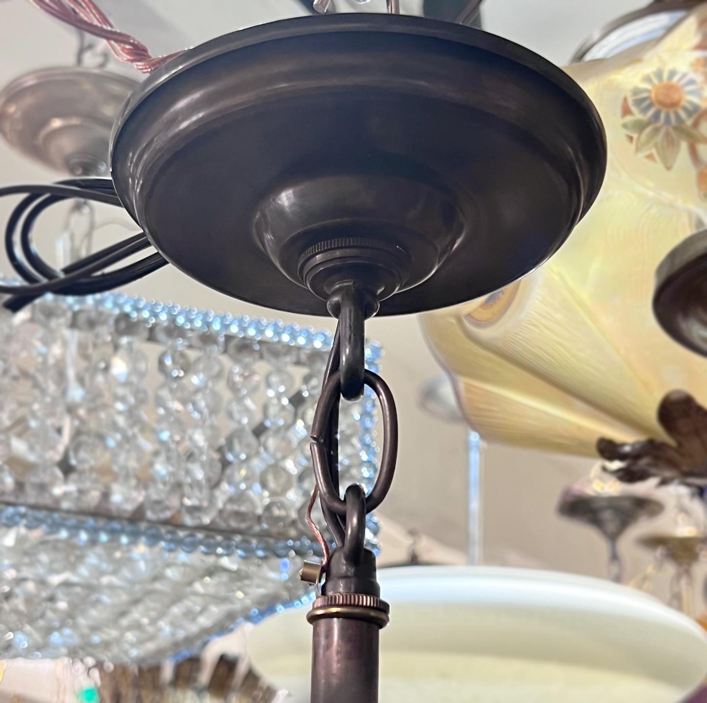 A circa 1900's Persian pierced light fixture with 4 candelabra interior lights.

Measurements:
Height: 23