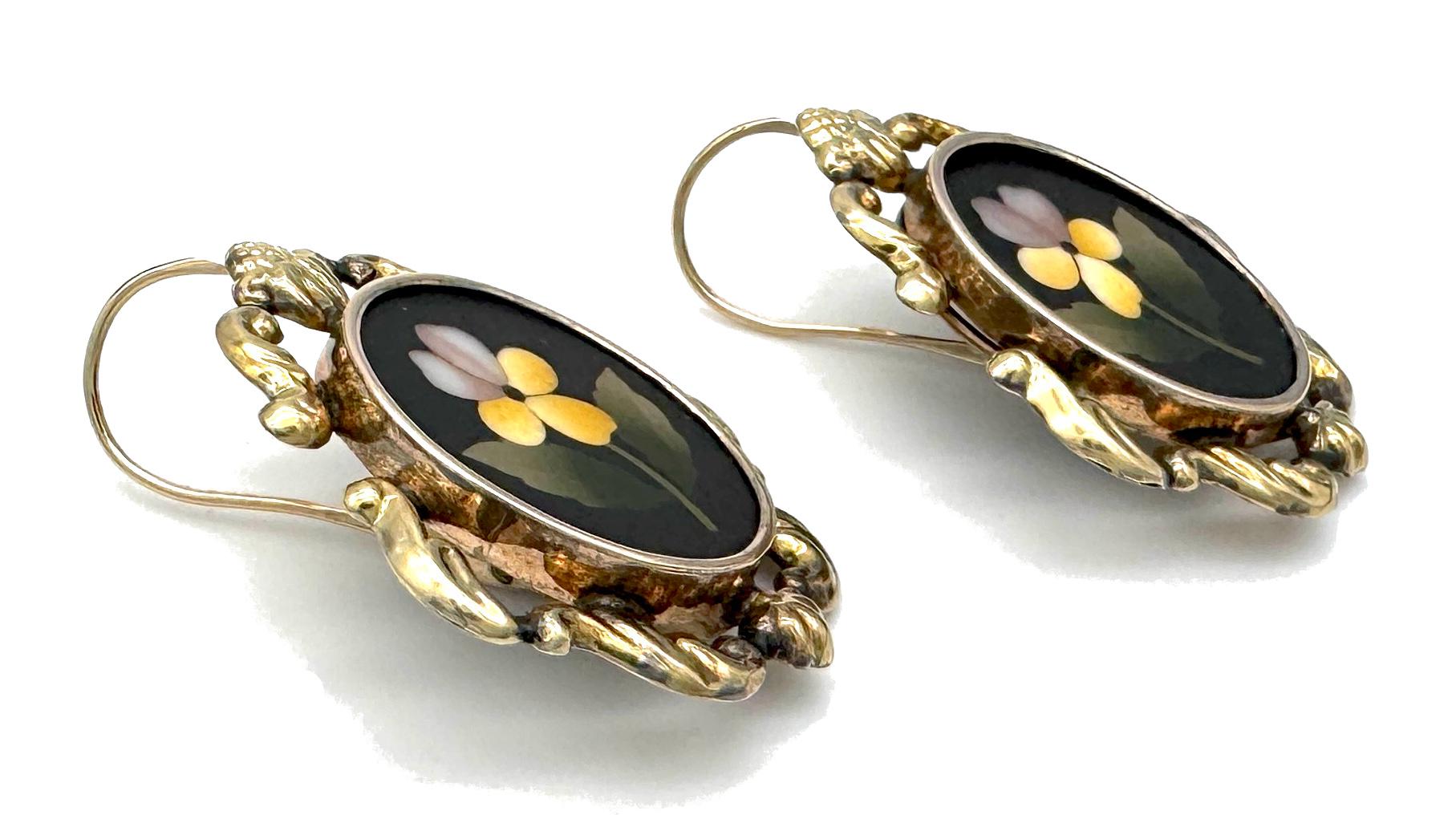 These unusual and rare pietre dure earrings were created in 1830 ca. They are of good size and have been well cared for over the last 190/195 years. The earrings and the mechanism are in their original condition. The oval black basalt plaques are