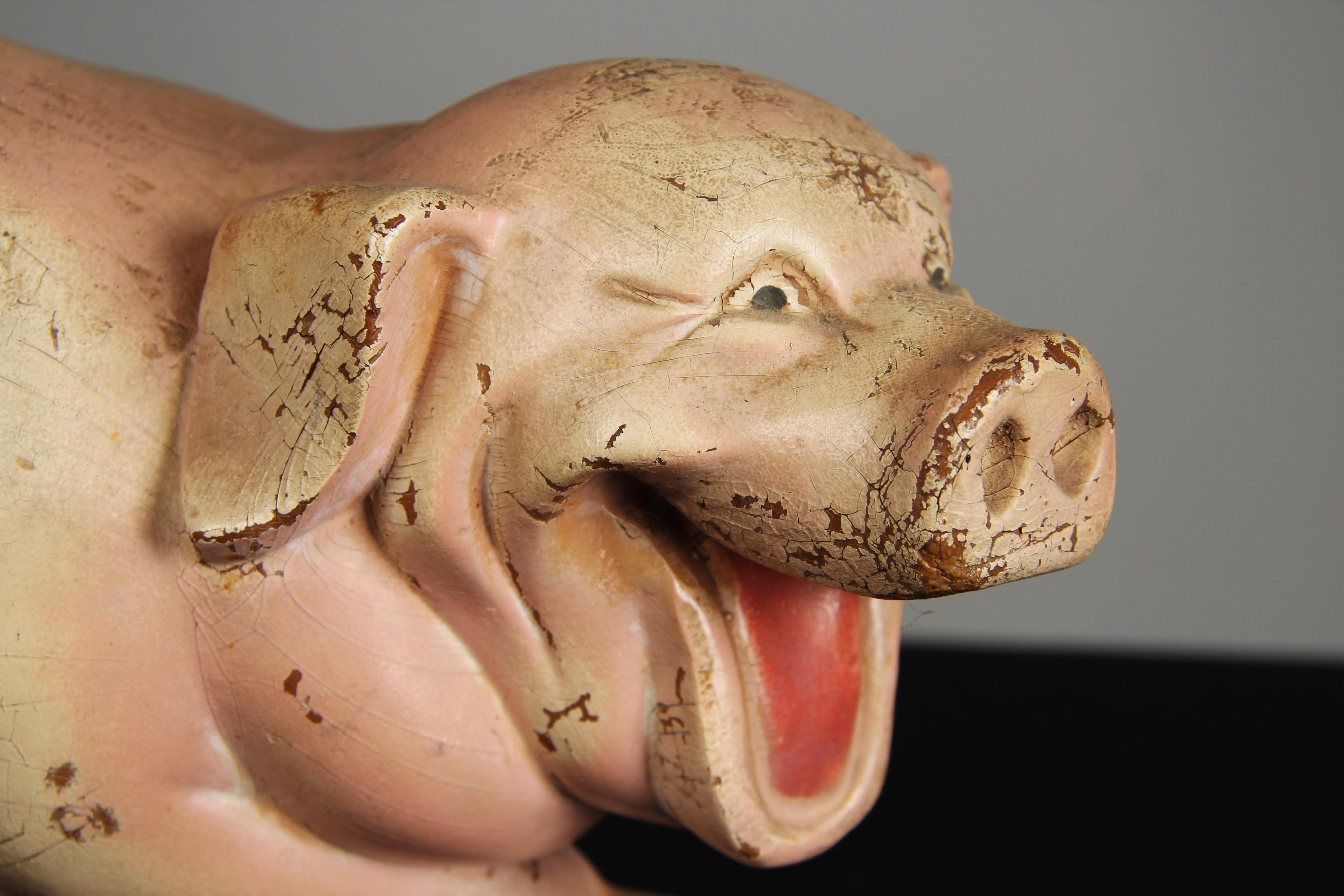 Original and nostalgic advertising figure from an old butcher's shop. It is easy to imagine how the pig adorned the shop window or an advertising display.

Authentic condition with age-appropriate rubbing to the paint. There are no cracks or