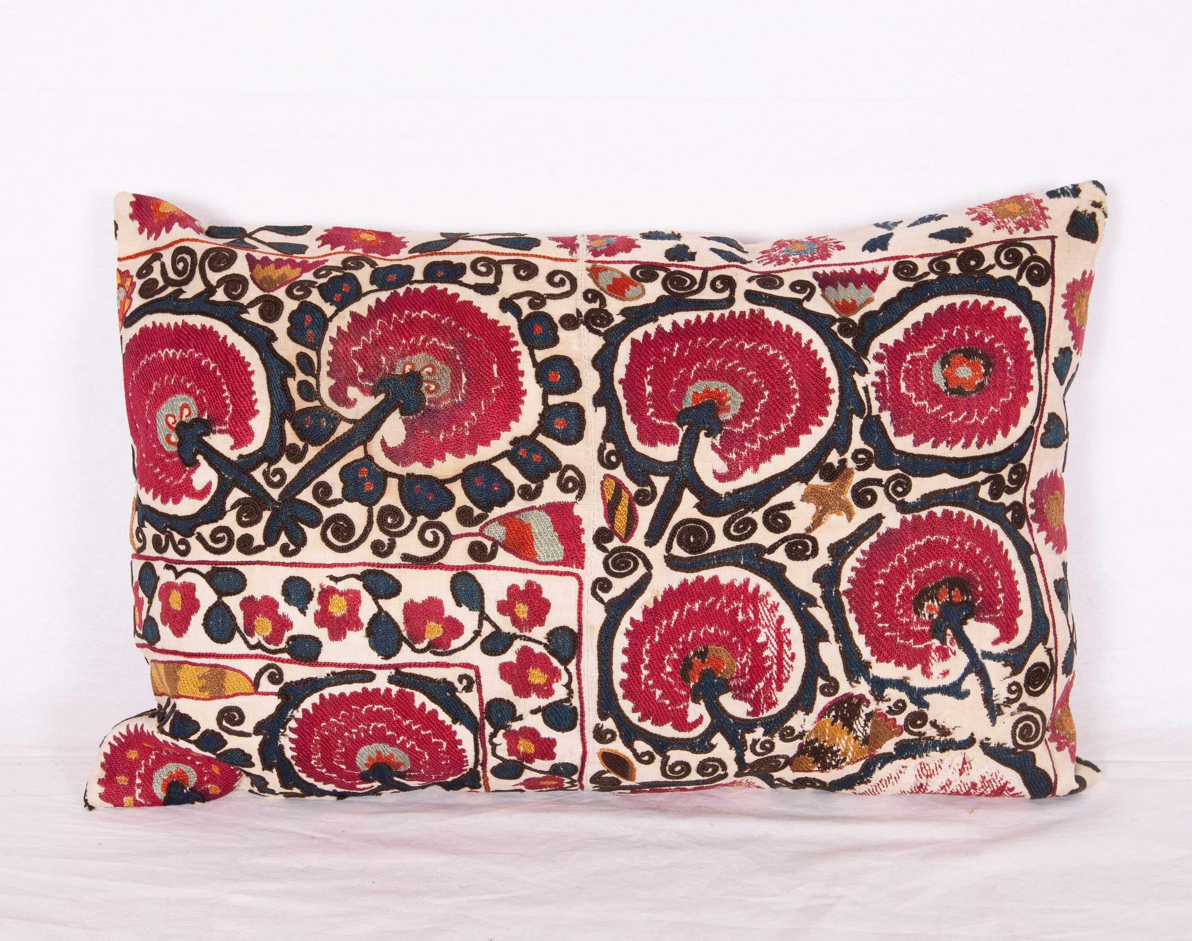 The pillow case is made from an antique Tajik Suzani from Ura Tube. It is silk embroidery on a handwoven cotton field. The backing is pure linen, and they do not come with inserts but bags made to the size in cotton to accommodate insert materials.