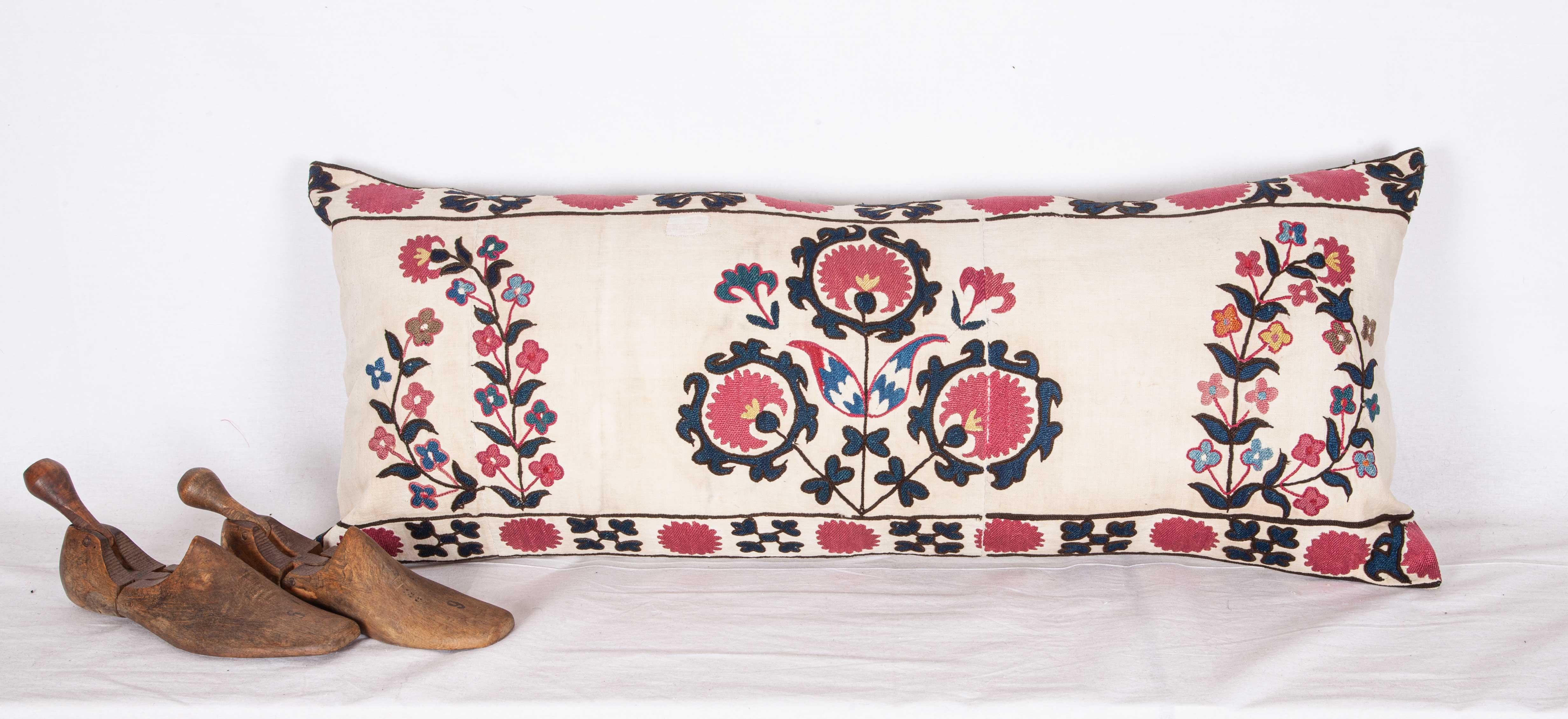A pillow case made from a rare white background Tashkent Suzani. It does not come with an insert but a bag made to the size to accommodate insert materials.
 