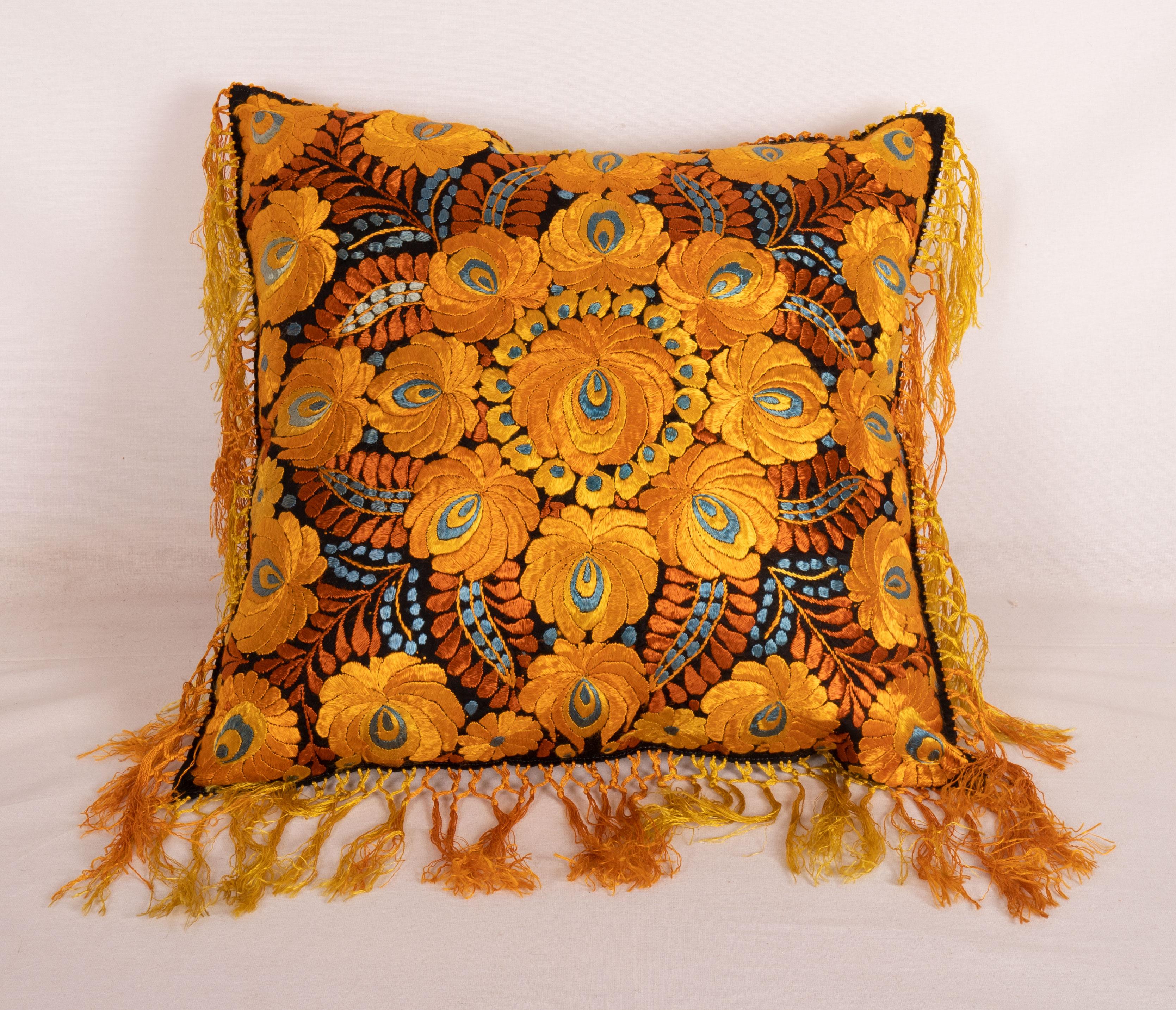 The pillow is made out of an early 20th century, Hungarian Matyo Embroidery. It does not come with an insert but it comes with a bag made to the size and out of cotton to accommodate the filling. The backing is made of cotton. Please note ' filling