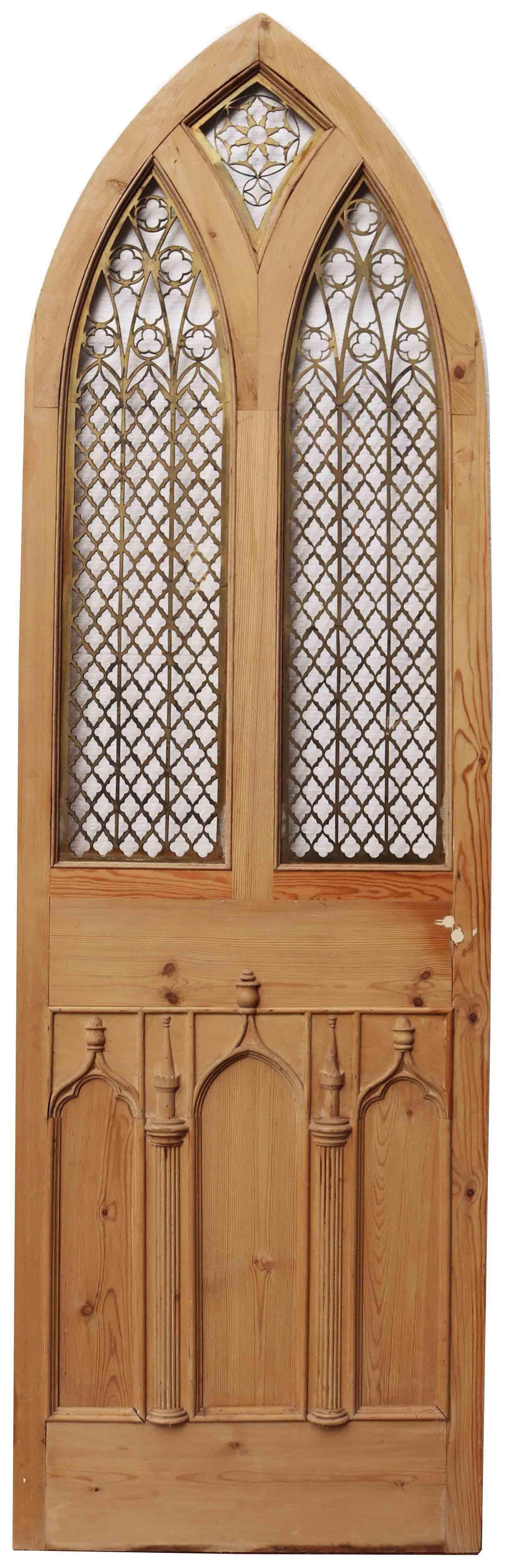 About:

This unusual arched pine door features decorative pierced brass grills and decorative molding to the lower half.

We have two of these doors available.

Condition report:

There is no glazing present. There has been a small repair to