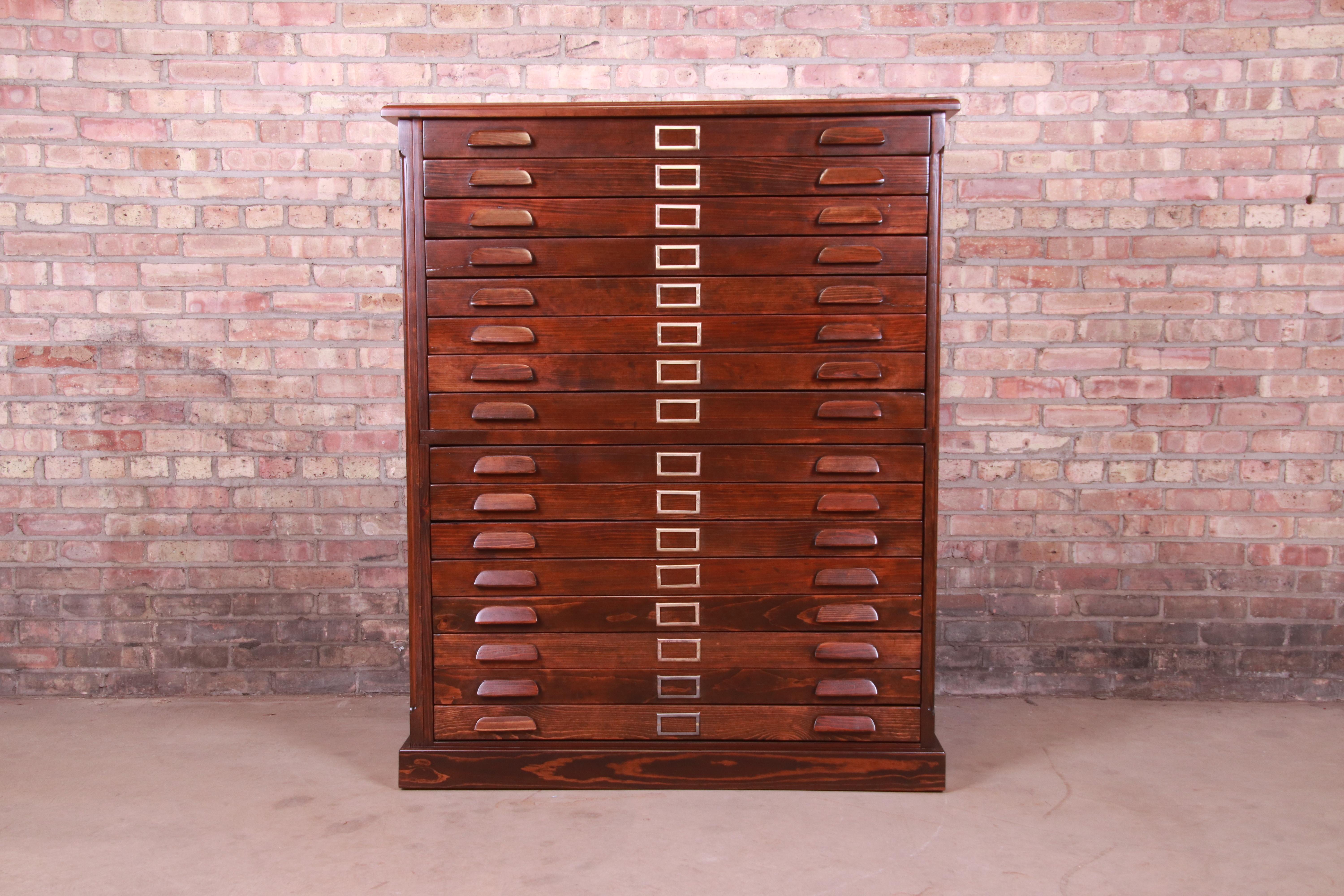 A rare and exceptional antique Arts & Crafts architect's blueprint or map 16-drawer flat file cabinet

USA, early 20th century

Solid pine, with original hardware.

Measures: 44.75
