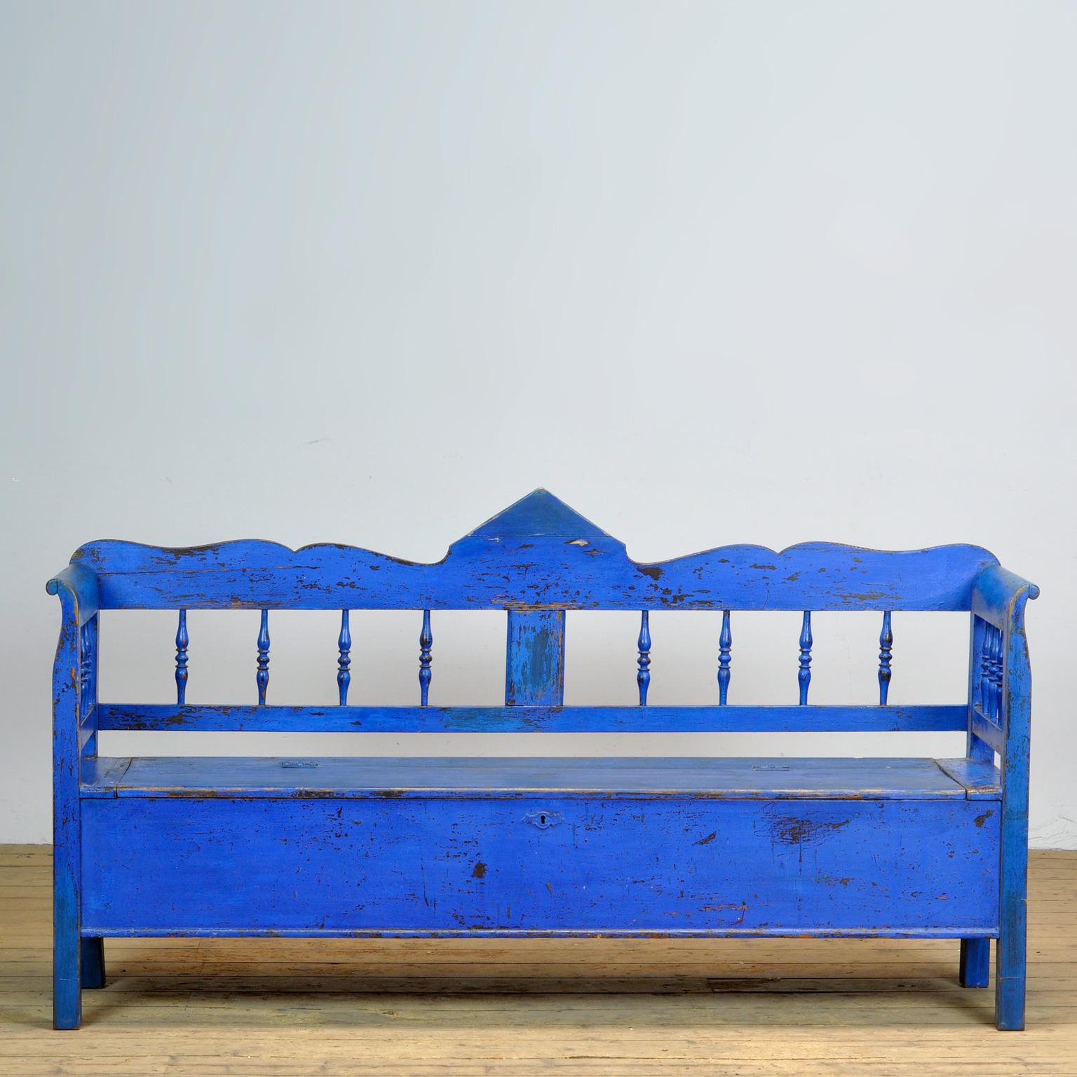 A charming bench from hungary with the original paint. Over time and use, the blue paint has been worn away in places to the wood. The bench is stable and sturdy. Free of woodworm.