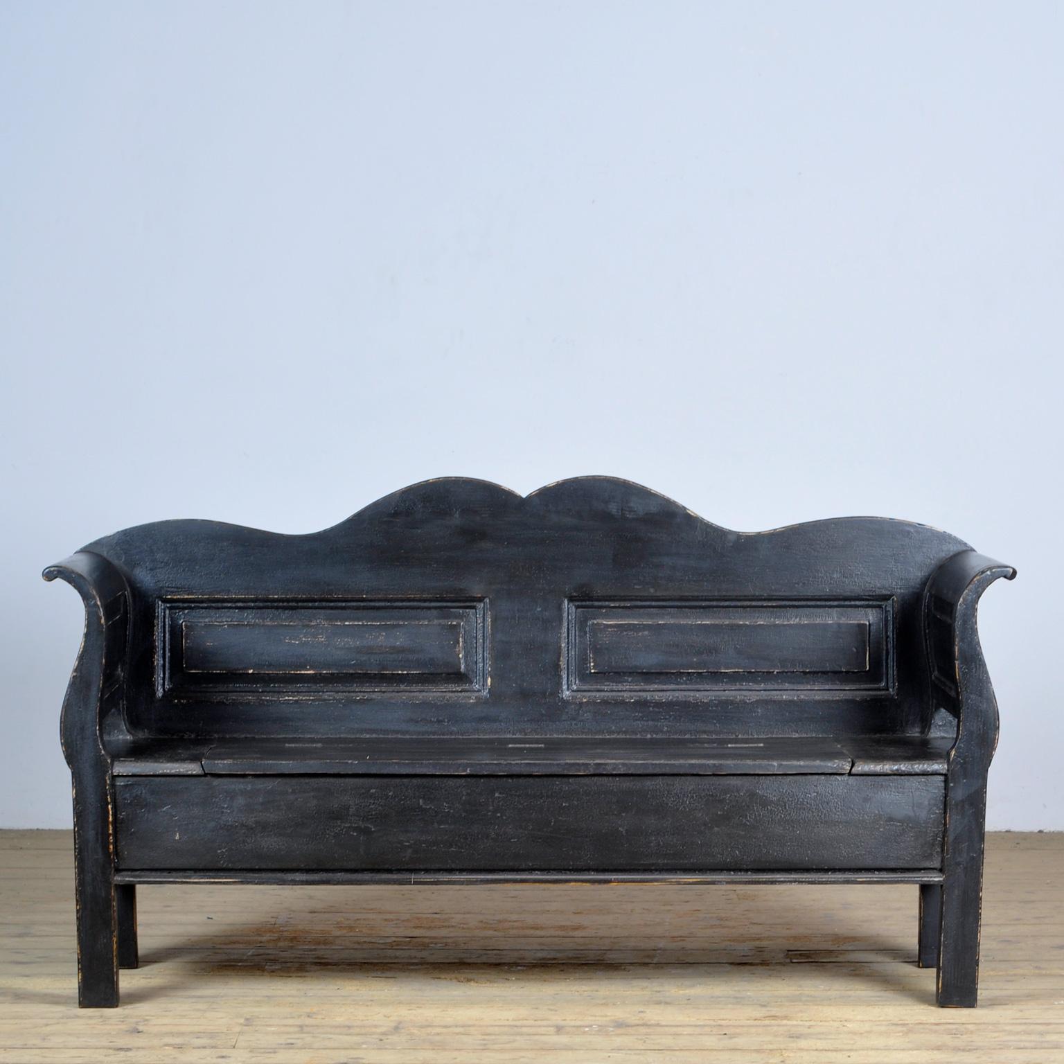 A charming bench from hungary with the original paint. Over time and use, the black paint has been worn away in places to the wood. With storage space under the seat. The bench is stable and sturdy. Free of woodworm. 