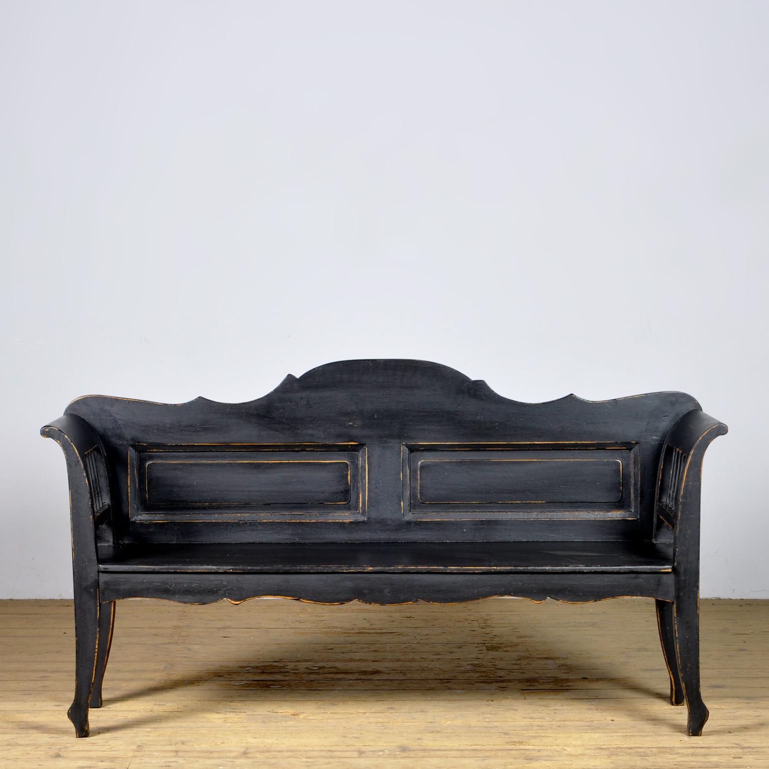 A charming bench from hungary with the original paint. Over time and use, the black paint has been worn away in places to the wood. The bench is stable and sturdy. Free of woodworm. 