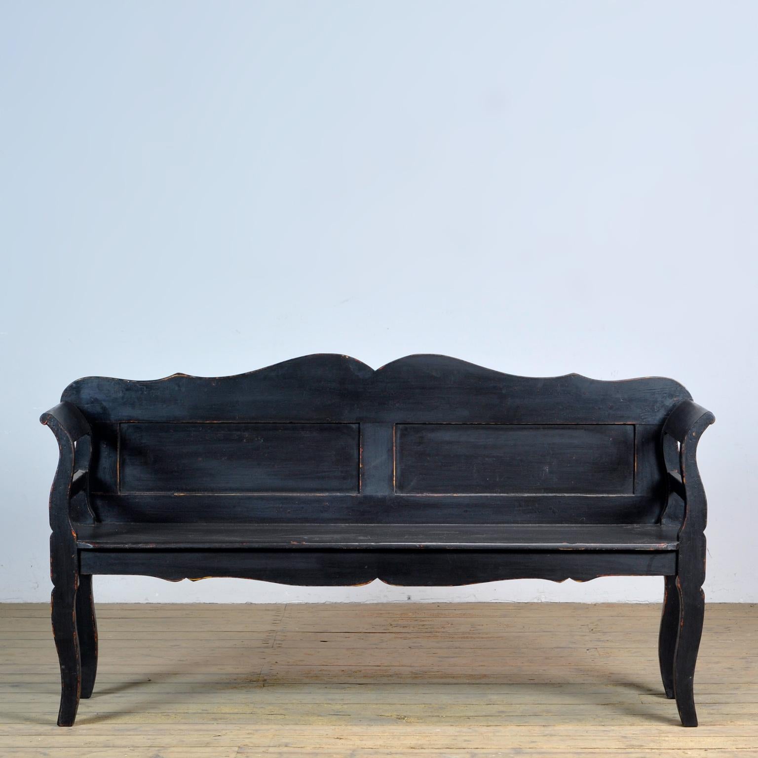A charming bench from hungary with the original paint. Over time and use, the black paint has been worn away in places to the wood. The bench is stable and sturdy. Free of woodworm. 