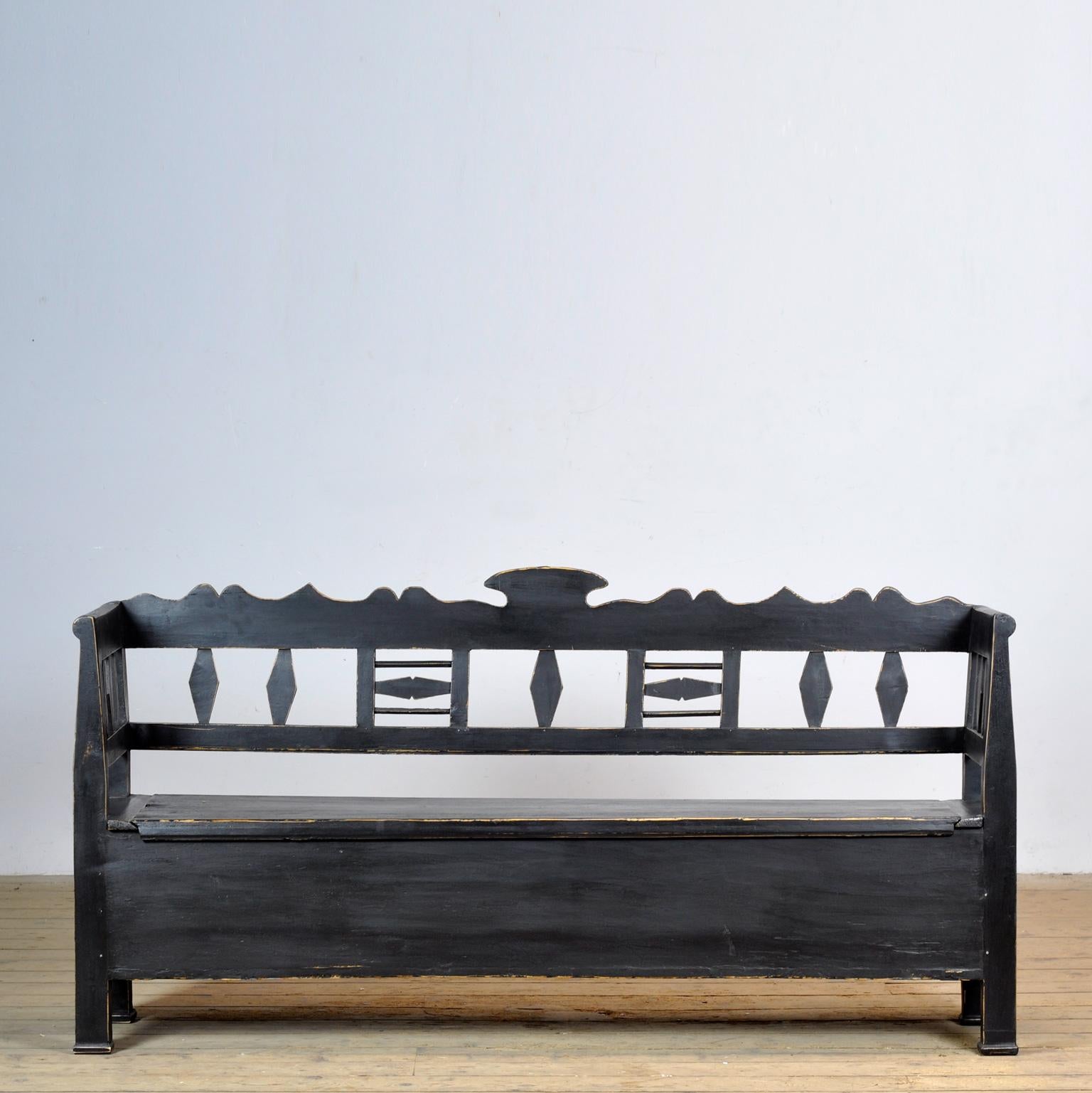 A charming bench from Hungary from around 1920. With a storage space under the seat divided into two compartments. The bench is stable and free of woodworm.