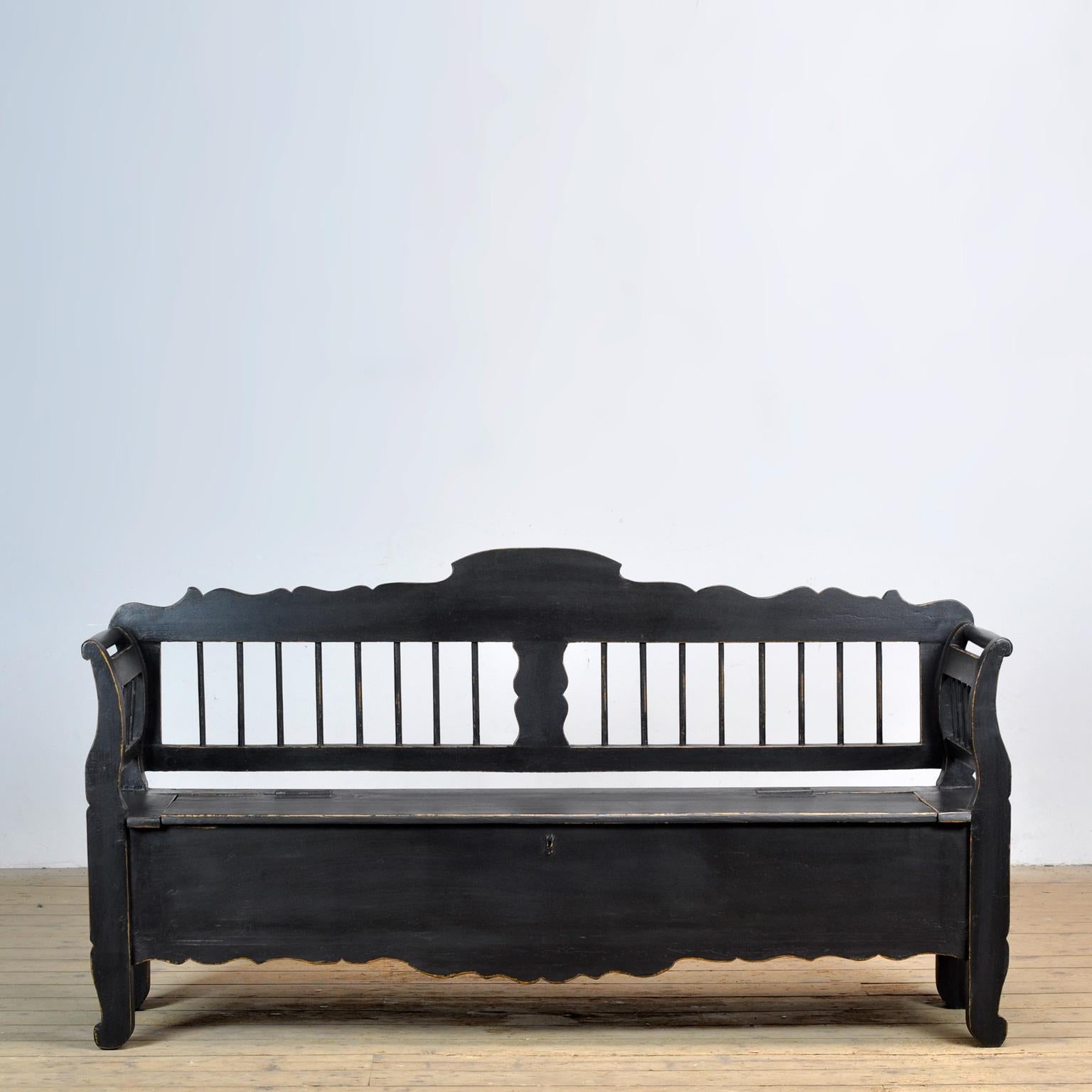 A charming bench from Hungary from around 1920. With a storage space under the seat divided into two compartments. The bench is stable and free of woodworm.