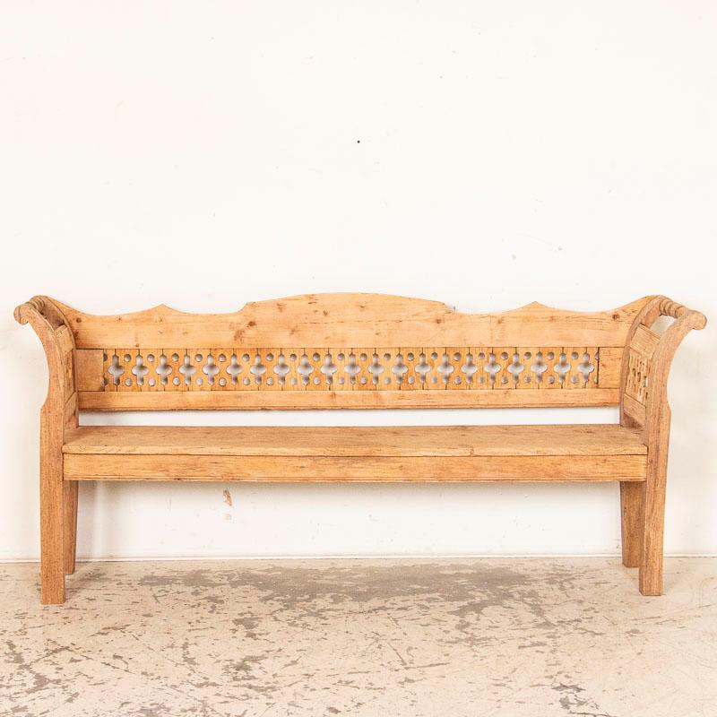 It is the distinctive lattice style back that gives this bench its wonderful country charm. Please enlarge the photos to examine the details, including the pine which has been left natural, leaving an organic feel to the bench. It is stable and
