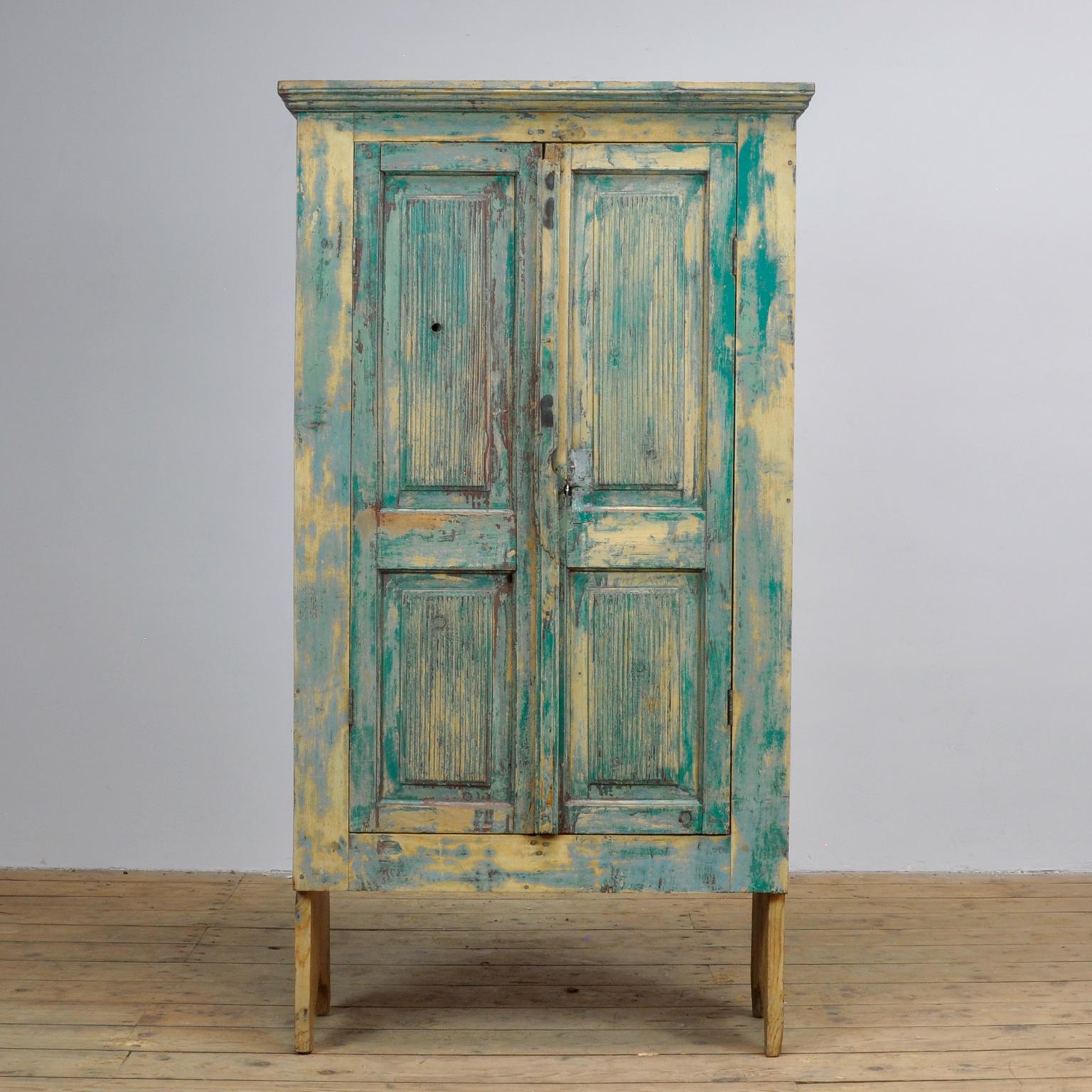 Pine cupboard from Moldova. Made circa 1910. Beautiful patina created by the various color layers that have been applied to it over the years.