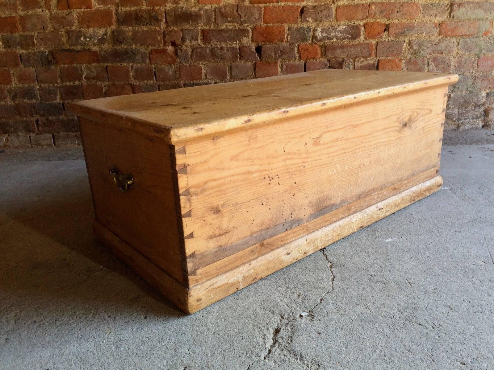 A beautiful antique 19th century Victorian solid pine blanket box or chest, lift up lid with two later brass carry handles to sides.