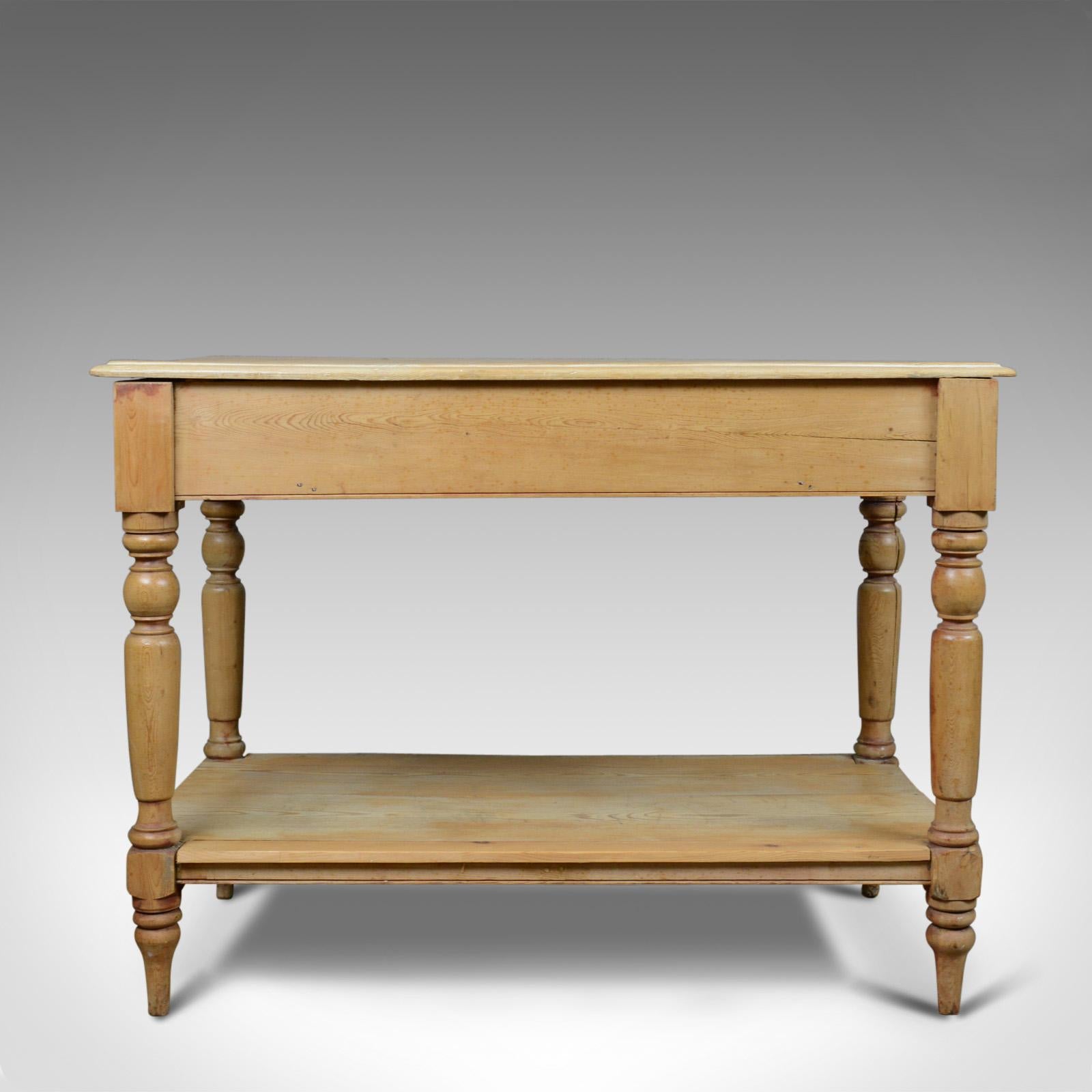 This is an antique pine console table. An English, Victorian kitchen work table dating to the late 19th century, circa 1880.

Mellow tones to the attractive antique pine
Grain interest and a desirable aged patina
Useful proportions and a good