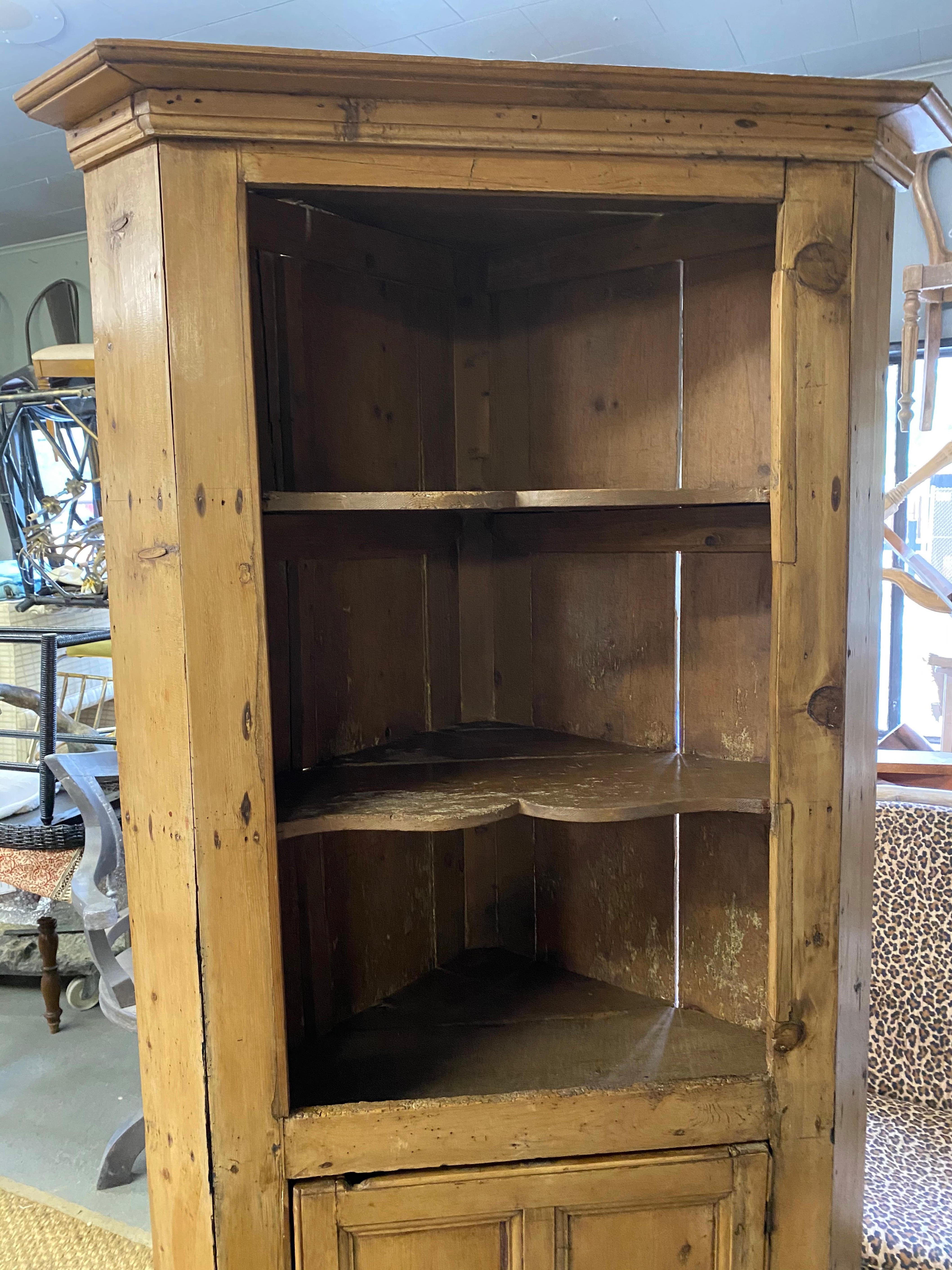 Full of character, this Swedish style open top corner cupboard is revealed in the aged patina of the pine. It has been given a wax finish, bringing out the warmth of the wood. Corner cupboards were a typical household item in turn of the century