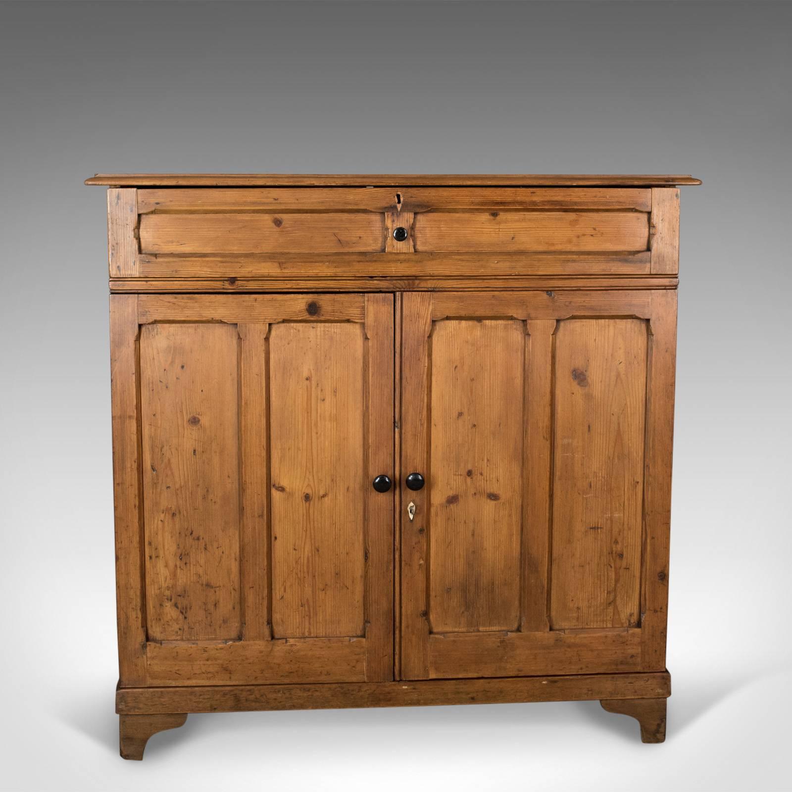This is an antique pine cupboard, an English, Victorian, panelled cabinet in pitch pine dating to circa 1880.

Attractive honey hues to the antique pitch pine
Grain interest in the lustrous, wax polished finish
Desirable aged patina
Two plank