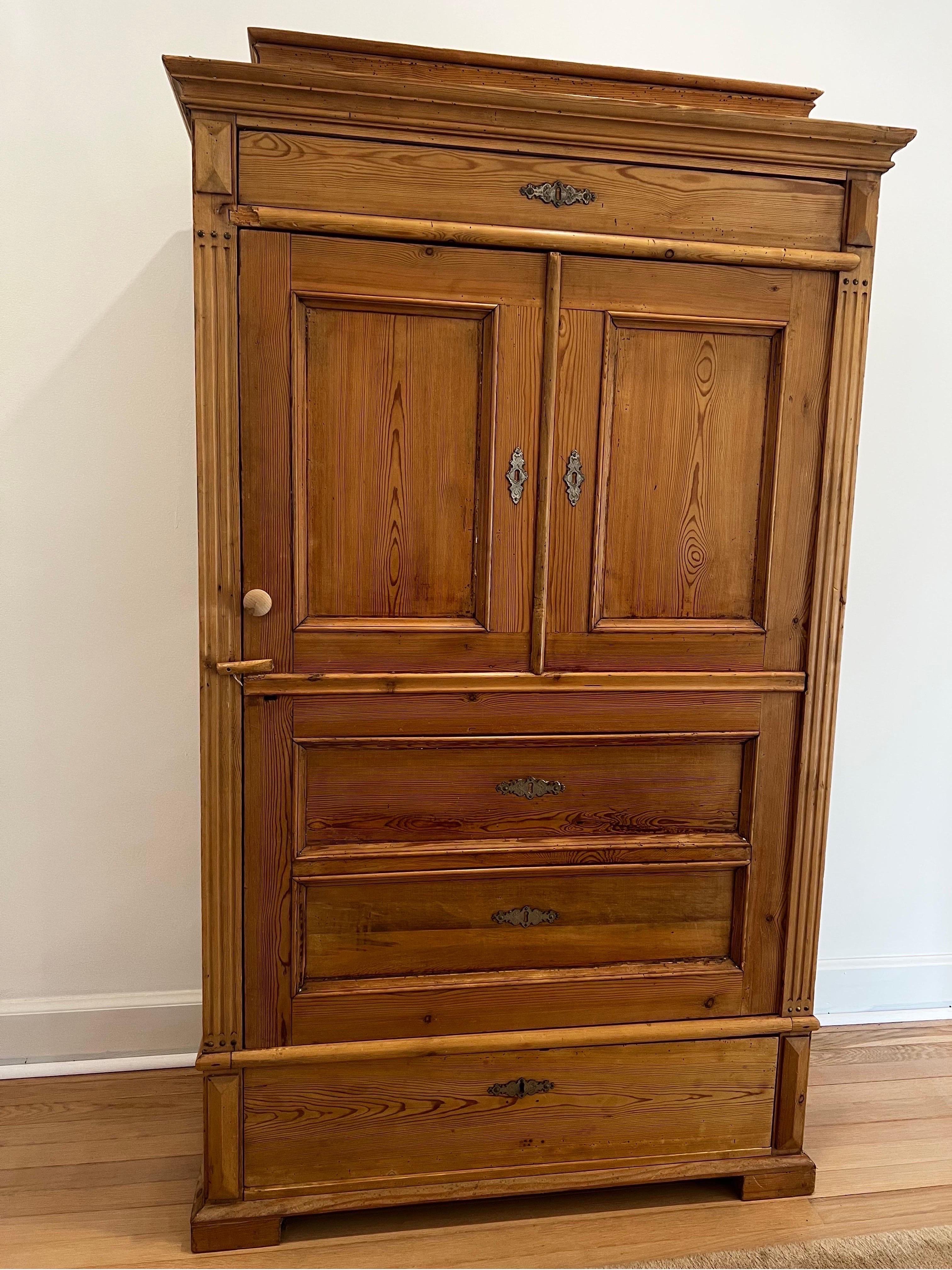 Antique pine cabinet. Removable shelves inside make it great for linen storage or cupboard. 
Clean lines and warm waxed pine are the hallmarks of this lovely armoire. Known as a 