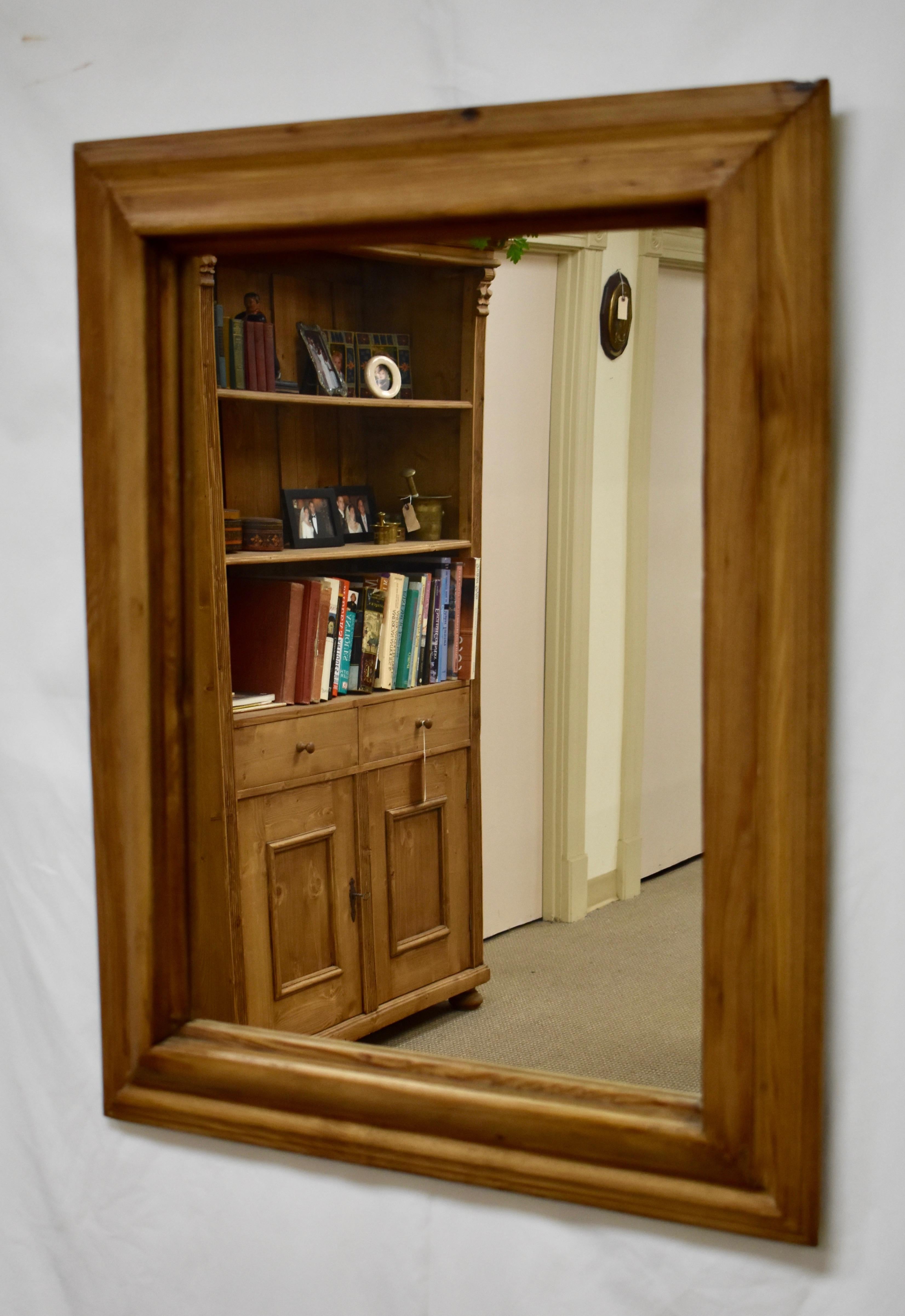 This is an antique pine frame with interesting contours to the molding. Hand-polished to a deep honey glow, and fitted with new mirror glass.
 