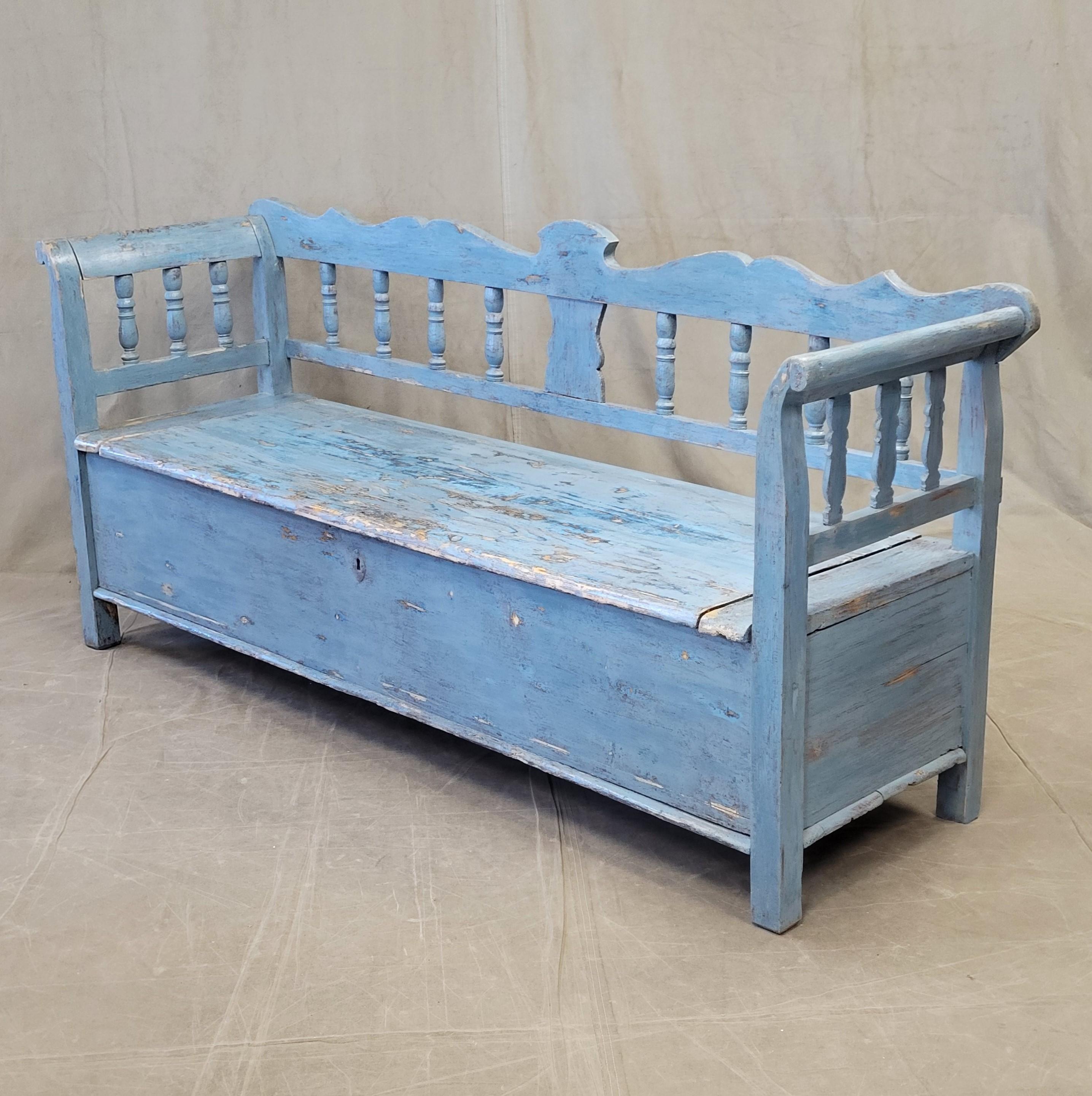 An absolutely charming antique 1920s or earlier Hungarian or Eastern European storage bench with old sky and colbalt blue paint. The old painted blue finish has been sanded smooth, sealed with furniture wax, and buffed to a beautiful sheen. Offers a