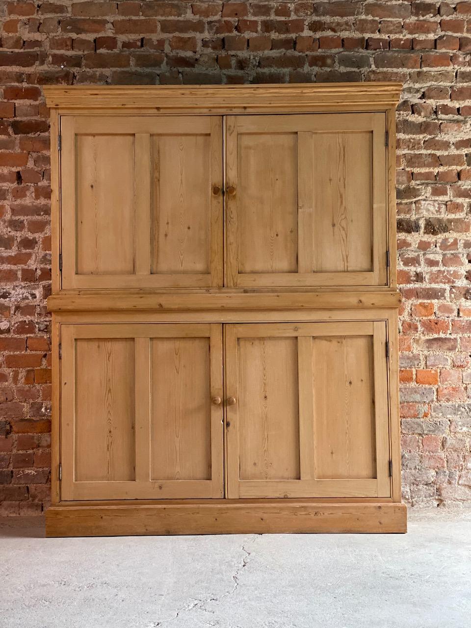 Antique pine school cupboard pantry, early 20th century

A magnificent early 20th century English solid pine school house cupboard, the rectangular corniced upper section over two paneled doors, the interior with shaped pelmet, divided in two