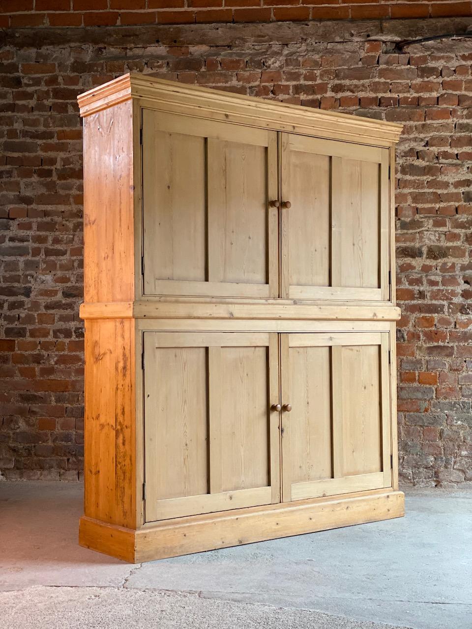 Antique pine school cupboard pantry, early 20th century

A magnificent early 20th century English solid pine school house cupboard, the rectangular corniced upper section over two paneled doors, the interior with shaped pelmet, divided in two