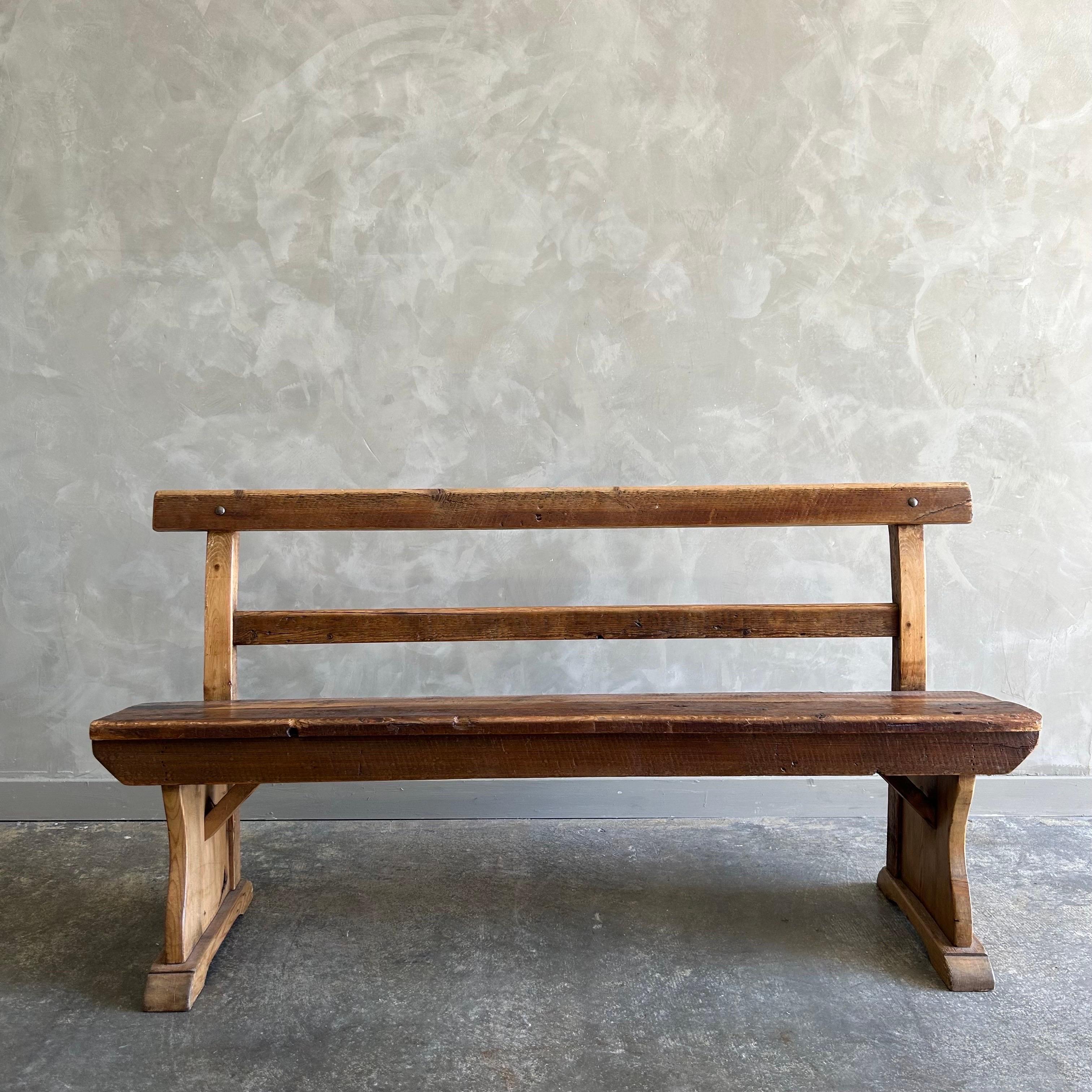 Antique pine settle bench 
Size 59”w x 19”d x 30”h 
Solid and sturdy, great for an entry or any room. Solid pine in a medium brown stain, original finish.
Seat Height : 17”. 
Seat D: 11”