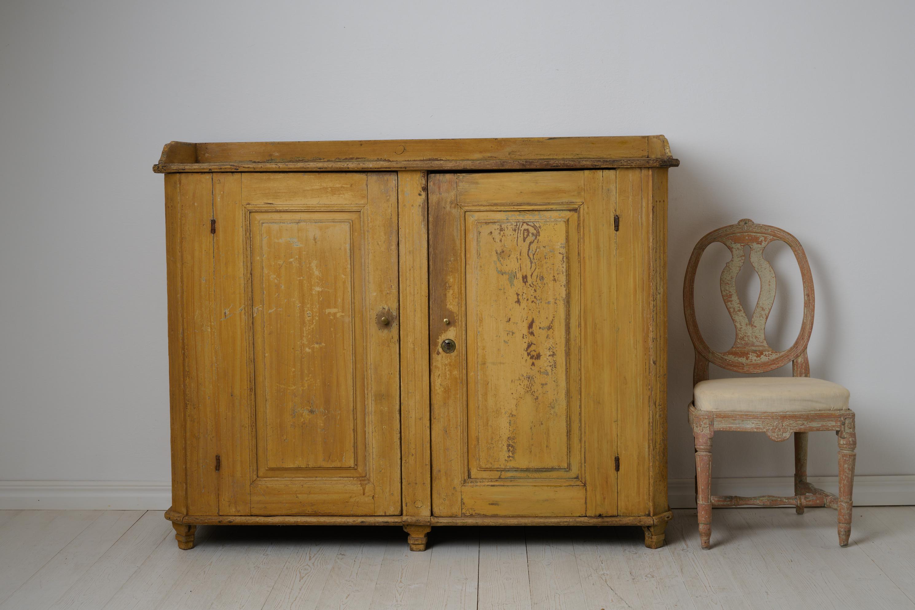 Sideboard from the Swedish gustavian period made in northern Sweden around 1790. This antique sideboard is a genuine Swedish original furniture made by hand in solid pine. Untouched condition that shows all the almost 250 years of history. Faux