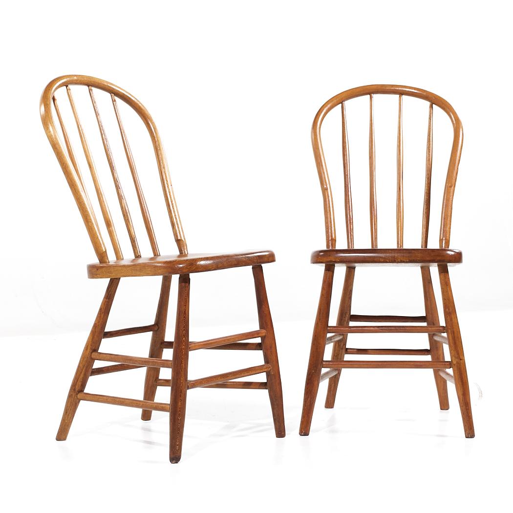 Antique Pine Spindle Side Dining Chairs - Pair

Each chair measures: 16.25 wide x 20.5 deep x 35 inches high, with a seat height/chair clearance of 17.5 inches

About Photos: We take our photos in a controlled lighting studio to show as much detail