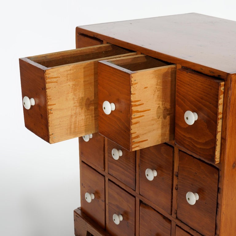 Antique Pine TwelveDrawer Apothecary with Porcelain Knobs