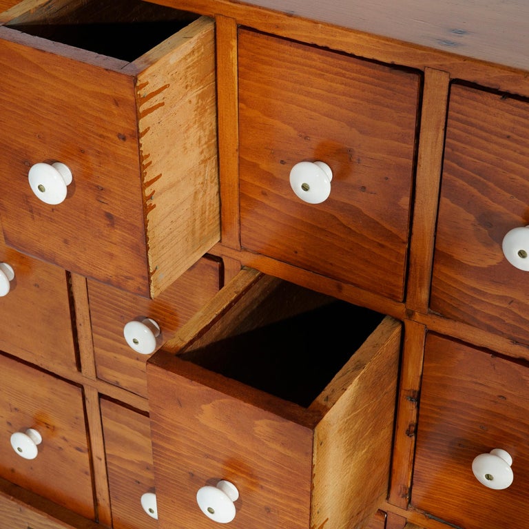 Antique Pine TwelveDrawer Apothecary with Porcelain Knobs