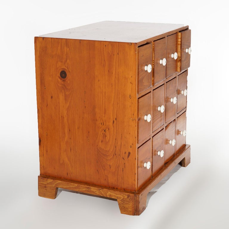Antique Pine TwelveDrawer Apothecary with Porcelain Knobs