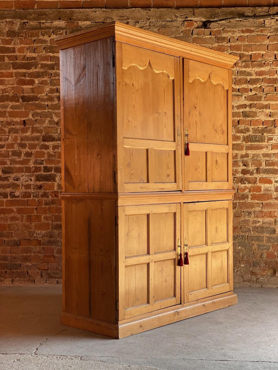 Antique pine wardrobe Housekeepers cupboard 19th century Victorian circa 1890

Fabulous large antique pine wardrobe or housekeepers cupboard circa 1890, the corniced top above two panelled doors with one working lock, later added hanging rail to