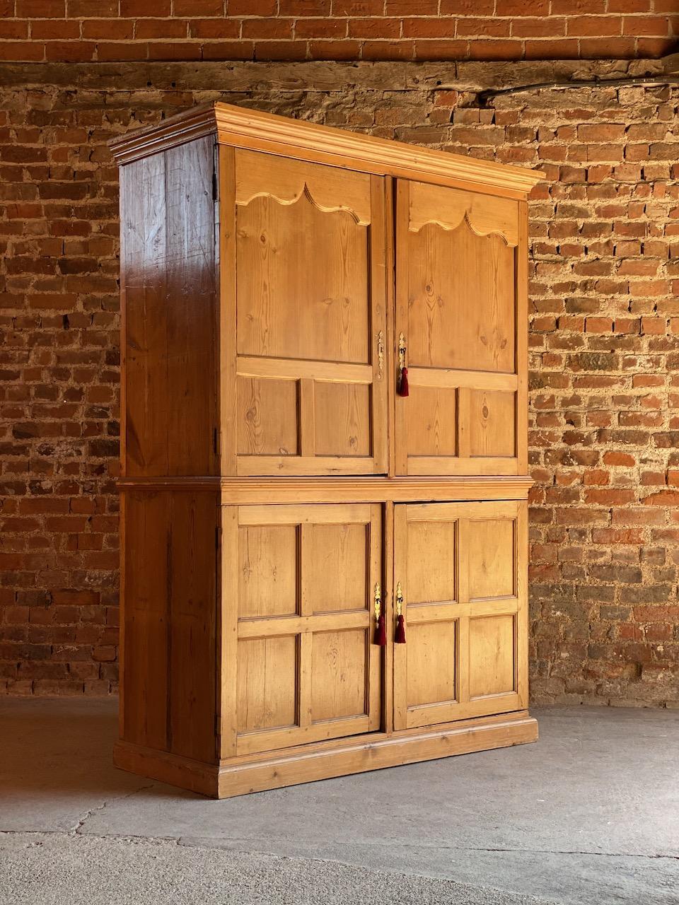 Antique pine wardrobe housekeepers cupboard 19th century Victorian circa 1890

Fabulous large antique pine wardrobe or housekeepers cupboard circa 1890, the corniced top above two panelled doors with one working lock, later added hanging rail to