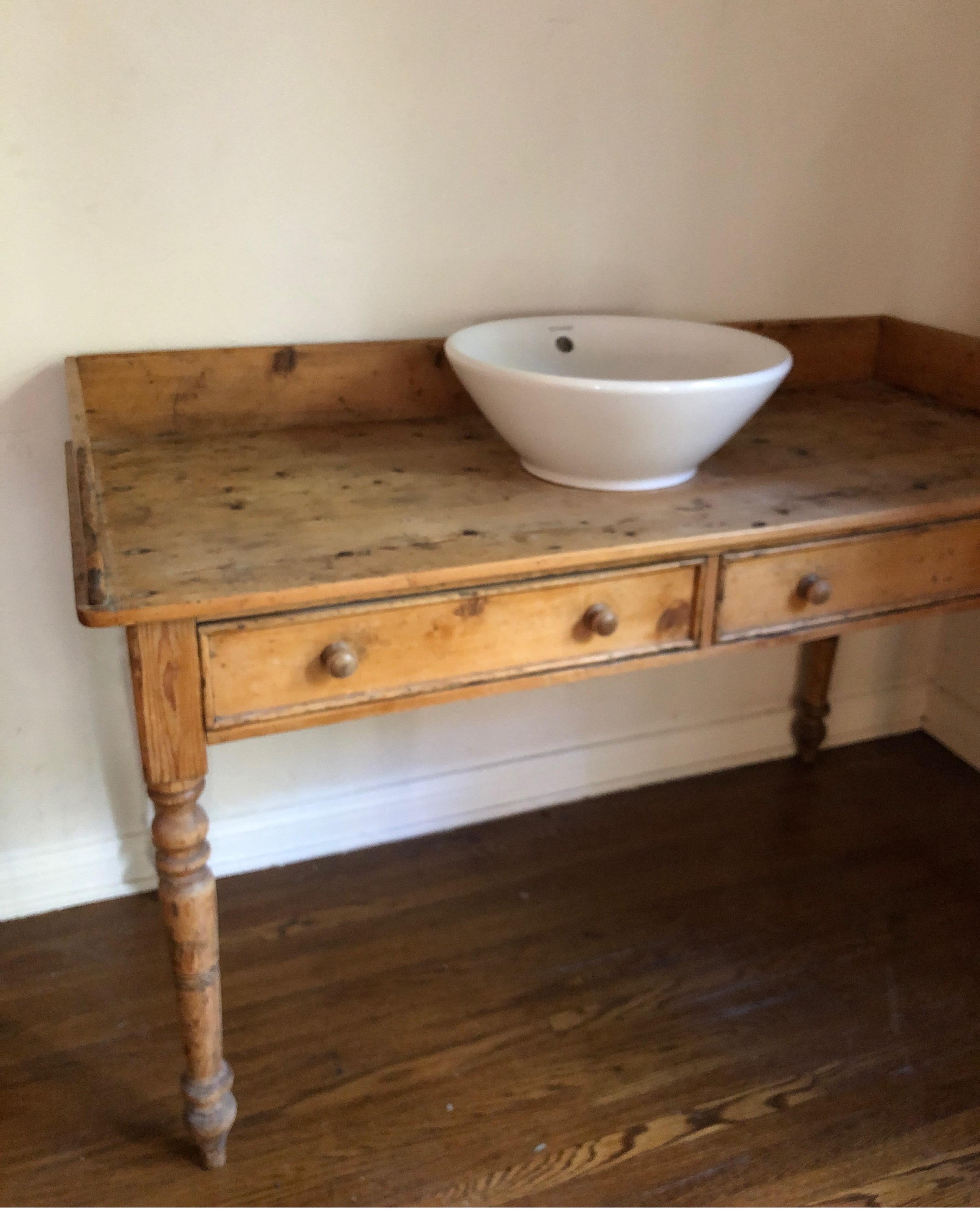 Antique pine farmhouse vanity.
Console has small hole for sink...could put a piece of marble on top to make it a table again.

Gorgeous worn patina on wood. 
*Drawers non-usable. 

Measures 51 width x 22 depth. 33 height in the back and 28.5 in the