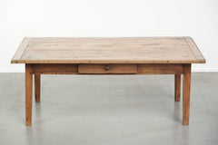 Antique pinewood coffee table with a drawer and a rural appearance