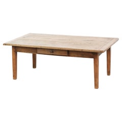 Antique pinewood coffee table with a drawer and a rural appearance
