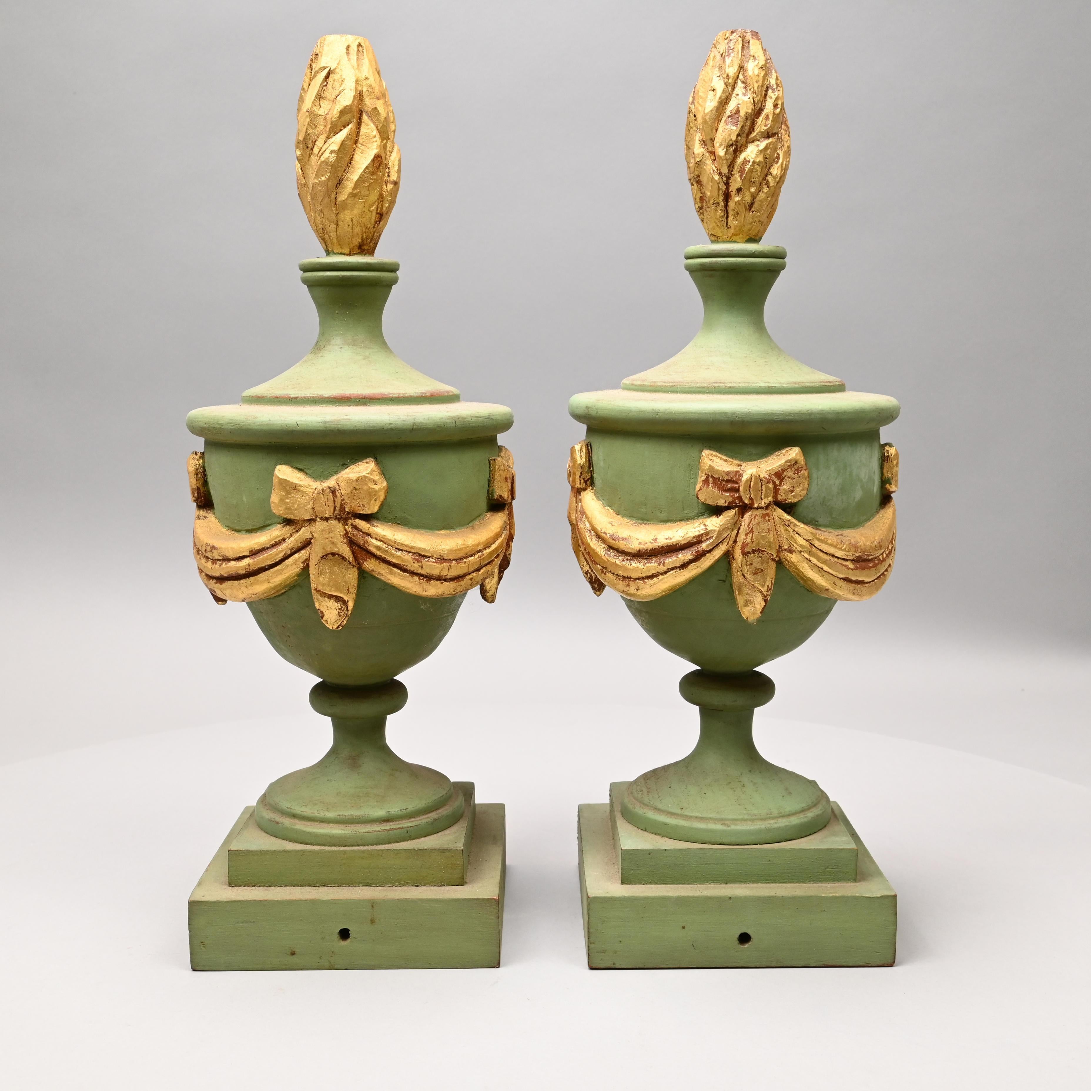 Decorative Pair of Wooden Light Green and Gold painted Architectural finials

Anonymous
Probably ate 19th or early 20th century; American in the European style
Painted and gilded pine wood

Approximate size: 18 x 6 in. 

The present pair of