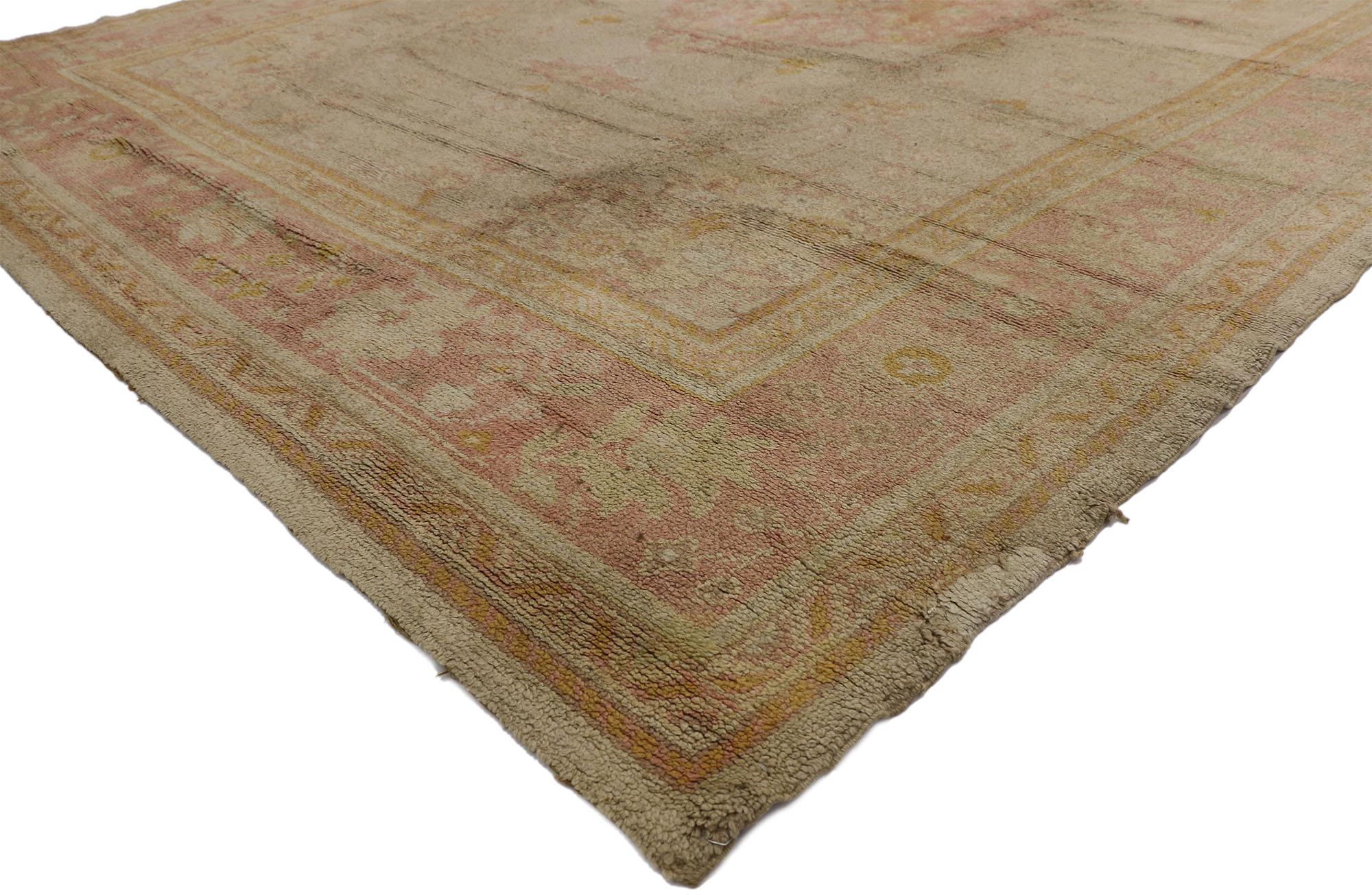 74018 Antique European Oushak Rug, 09'07 x 13'02. Antique-washed European Oushak rugs are distinguished by their naturally soft, faded colors, achieved through a special washing process maintaining the rug's fibers and structure. Originating from or