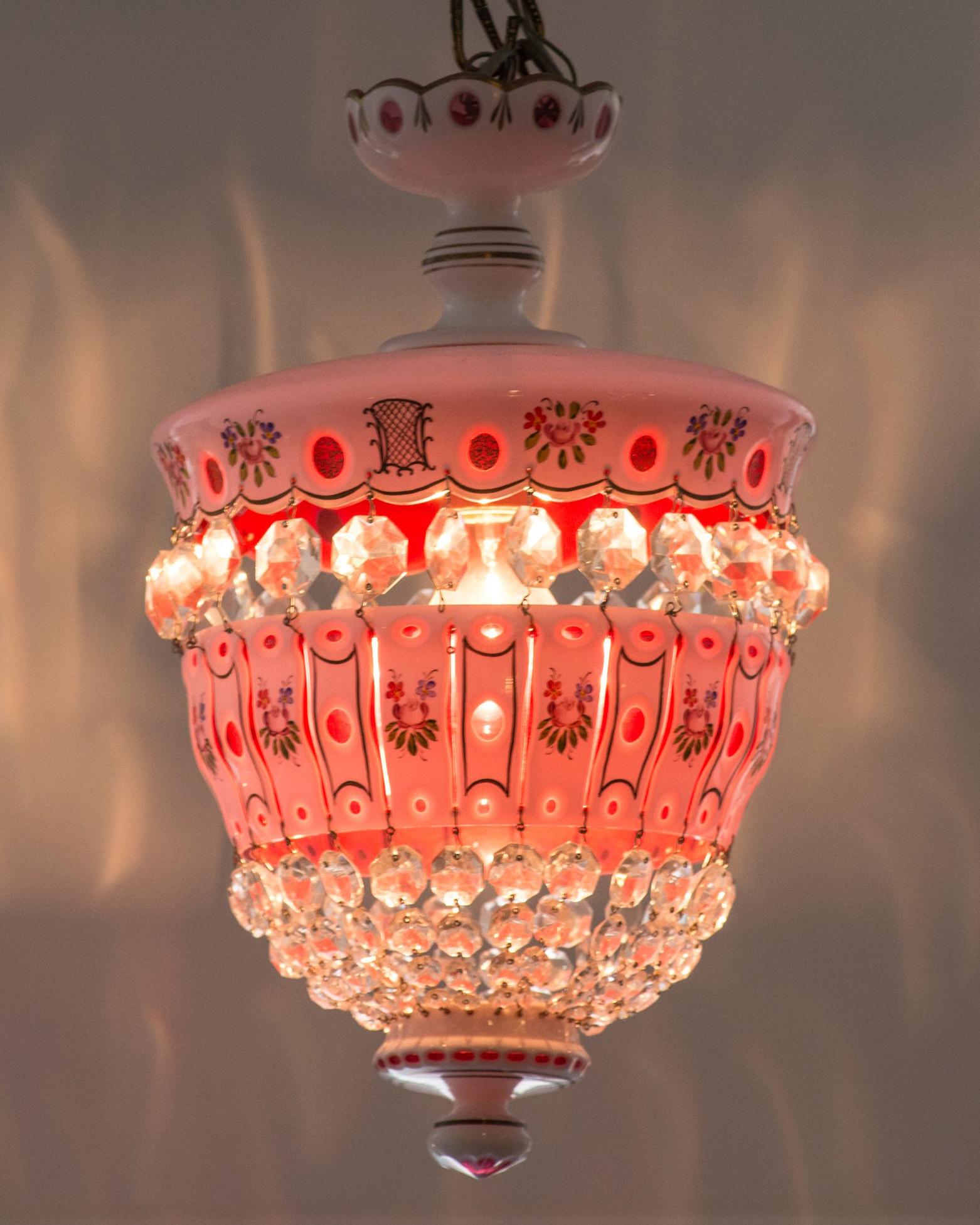 This delicate feminine antique bohemian pink and white chandelier would be perfect to illuminate a powder room, dressing room or girl’s bedroom. Known for its very unique and ornate aesthetic, antique bohemian glass is highly sought after and