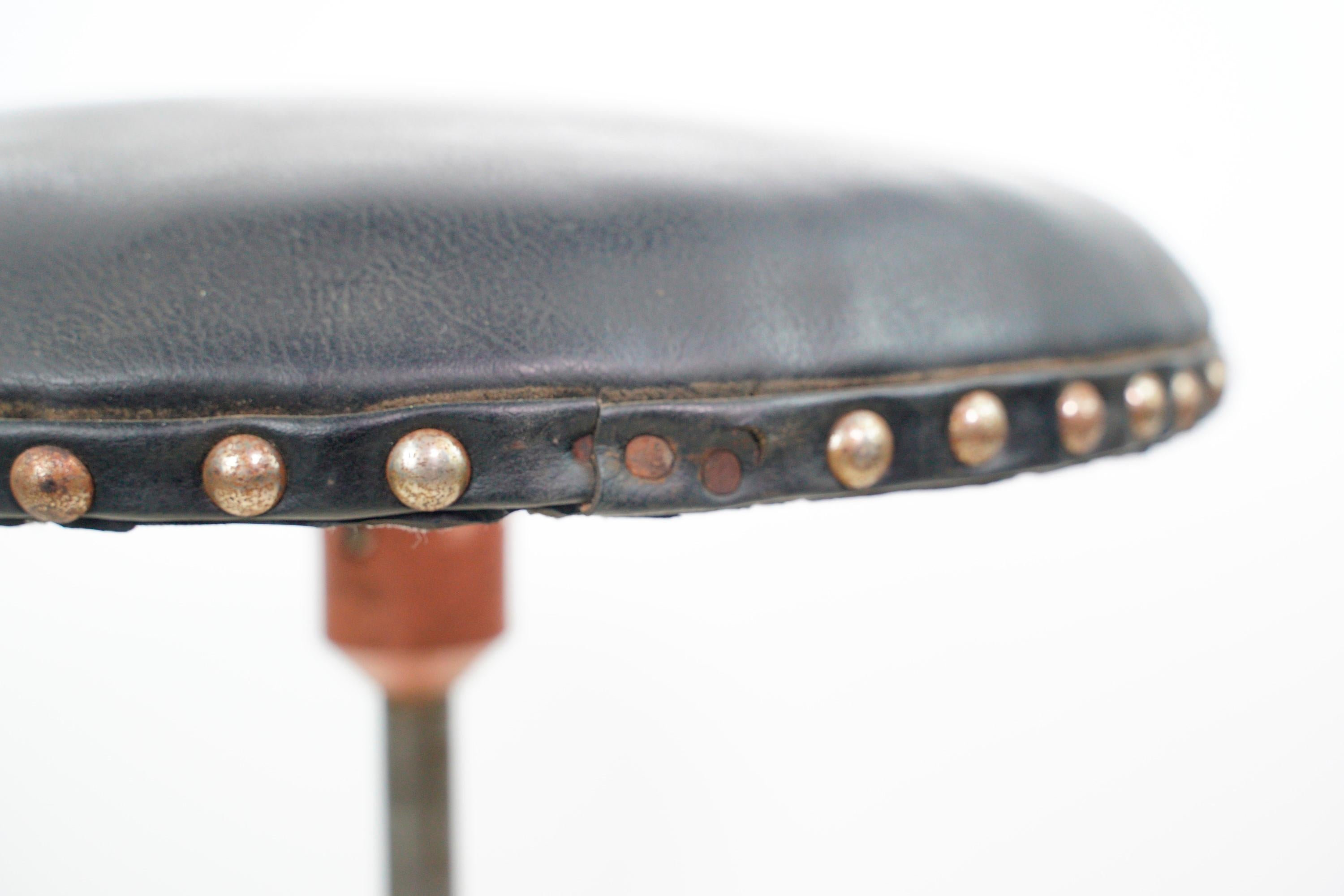 Antique Pink Cast Iron Base Adjustable Black Leather Stool In Good Condition For Sale In New York, NY