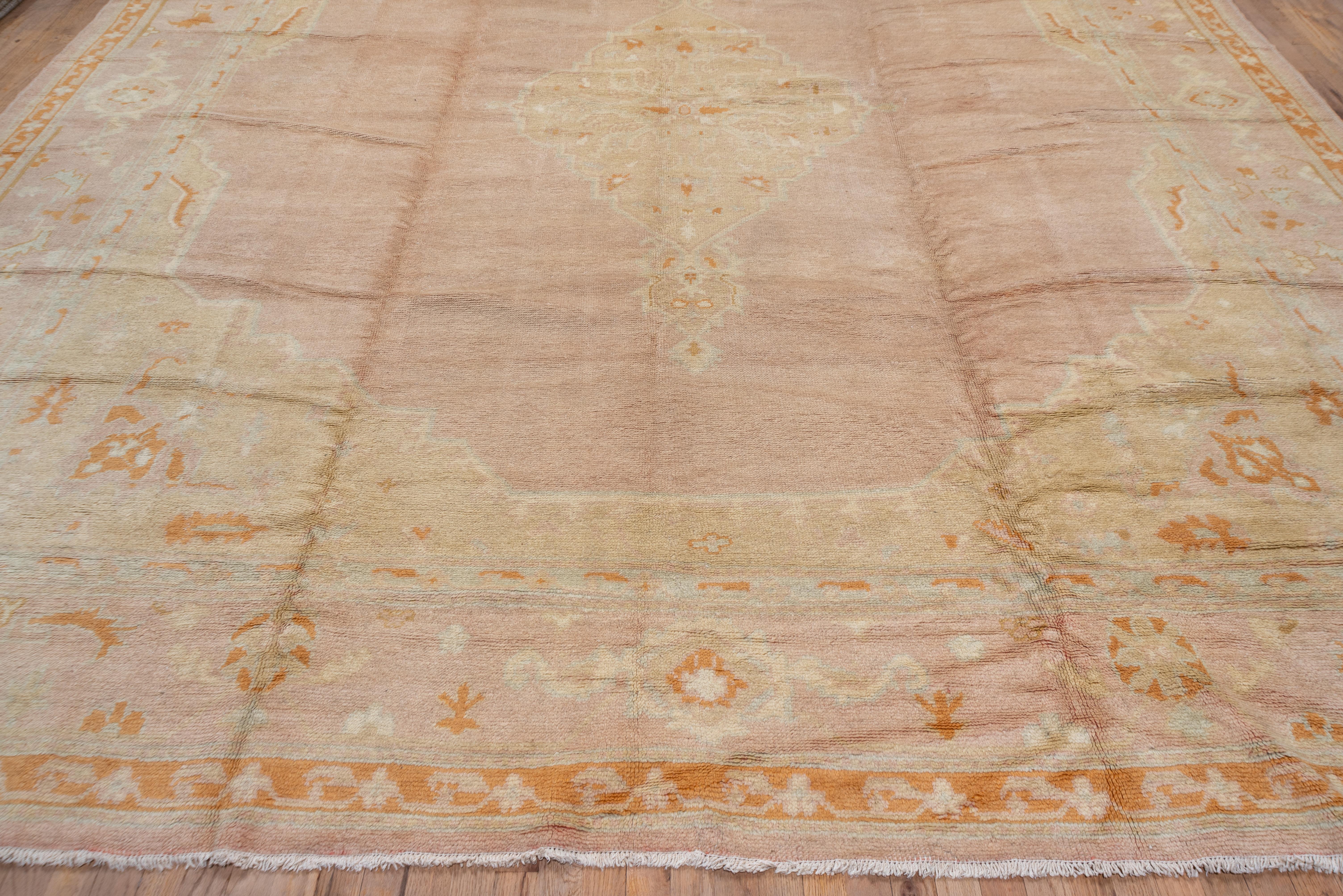 Hand-Knotted Antique Pink Turkish Oushak Carpet with Orange & Yellow Accents, circa 1920s For Sale