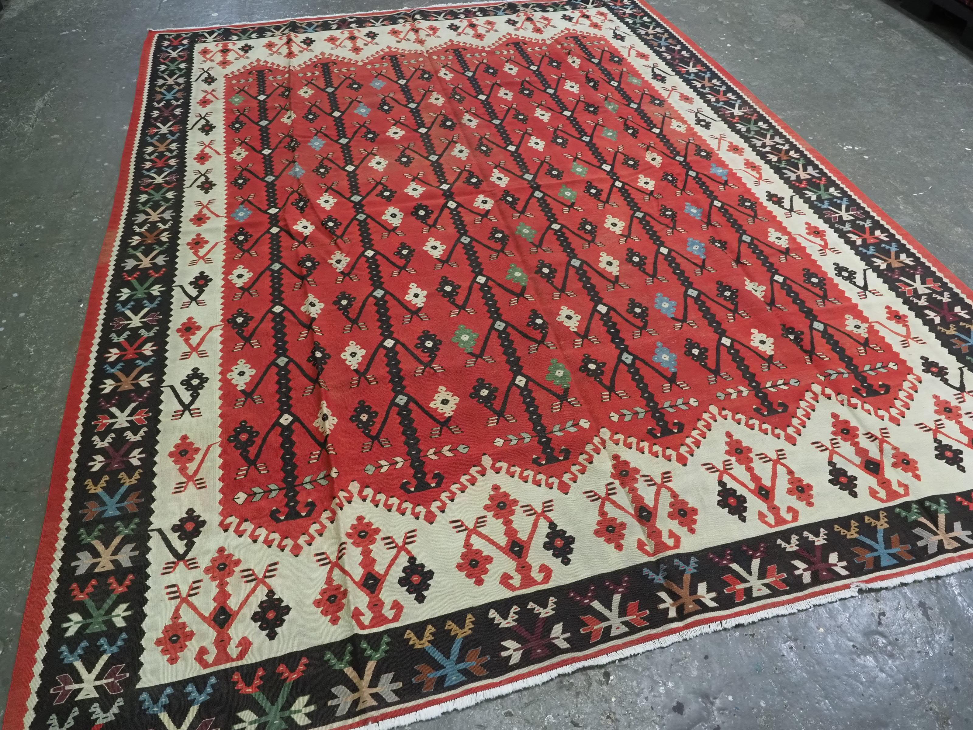 Size: 10ft 9in x 8ft 2in (328 x 250cm).

Antique Pirot / Sarkoy kilim of flowering tree design. A kilim of superb design and colour in a good room size.

Circa 1920.

Pirot kilims are also known as Sarkoy or Sharkoy, they originate from the town of