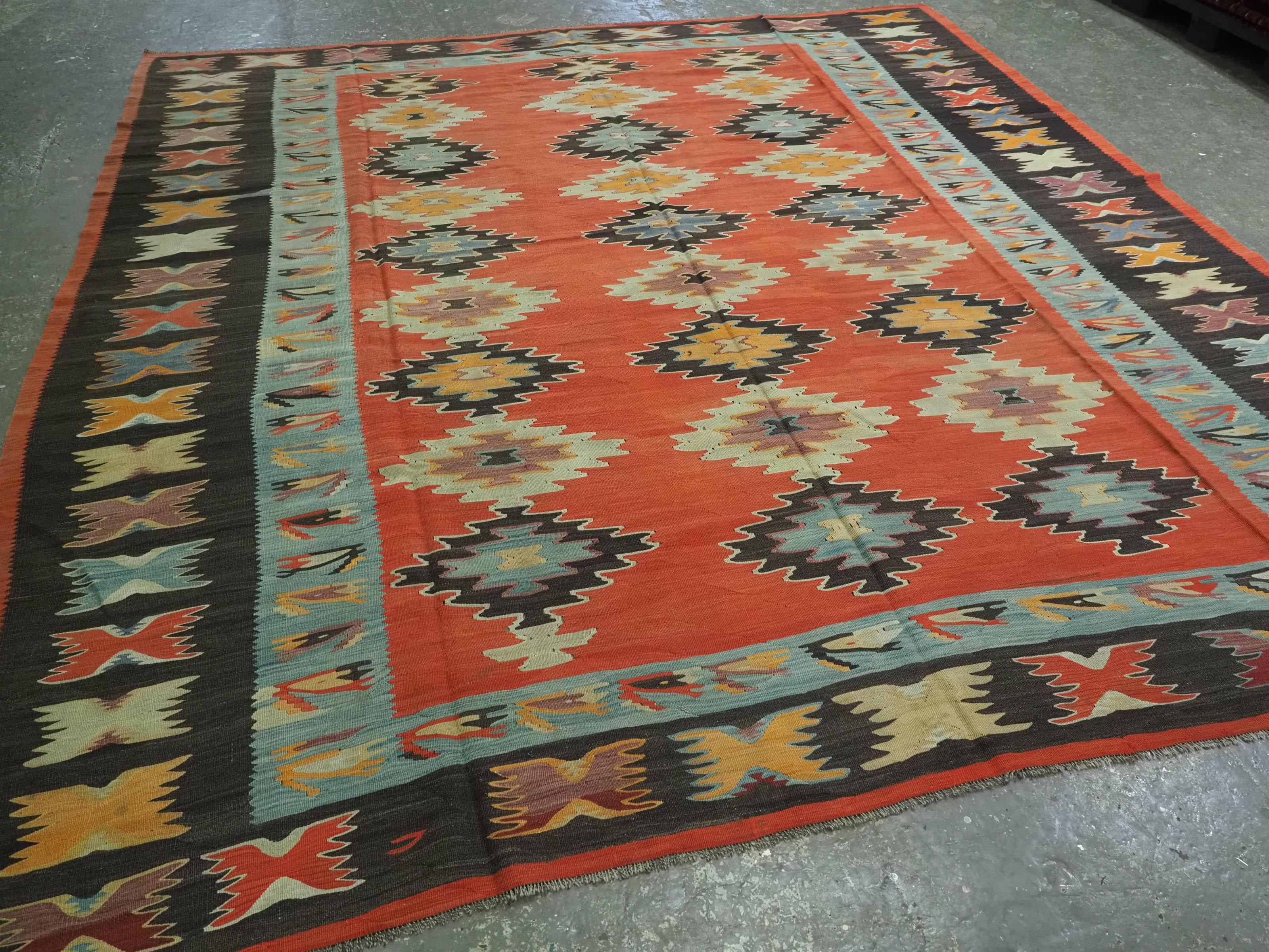 
Size: 11ft 3in x 10ft 1in (343 x 307cm).

Antique Pirot / Sarkoy kilim of repeat diamond medallion design. A kilim of large room size.

Circa 1920.

Pirot kilims are also known as Sarkoy or Sharkoy, they originate from the town of Pirot in