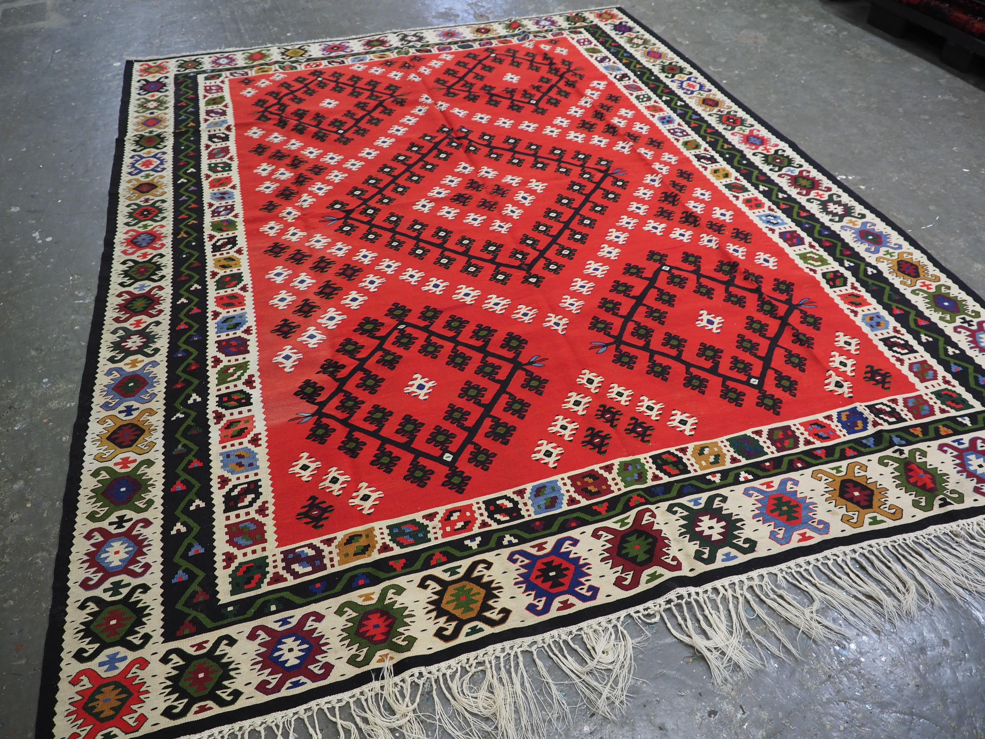 
Size: 9ft 8in x 7ft 10in (295 x 239cm).

Antique Pirot / Sarkoy kilim of traditional design. A kilim of good room size.

Circa 1920.

Pirot kilims are also known as Sarkoy or Sharkoy, they originate from the town of Pirot in south-eastern Serbia;