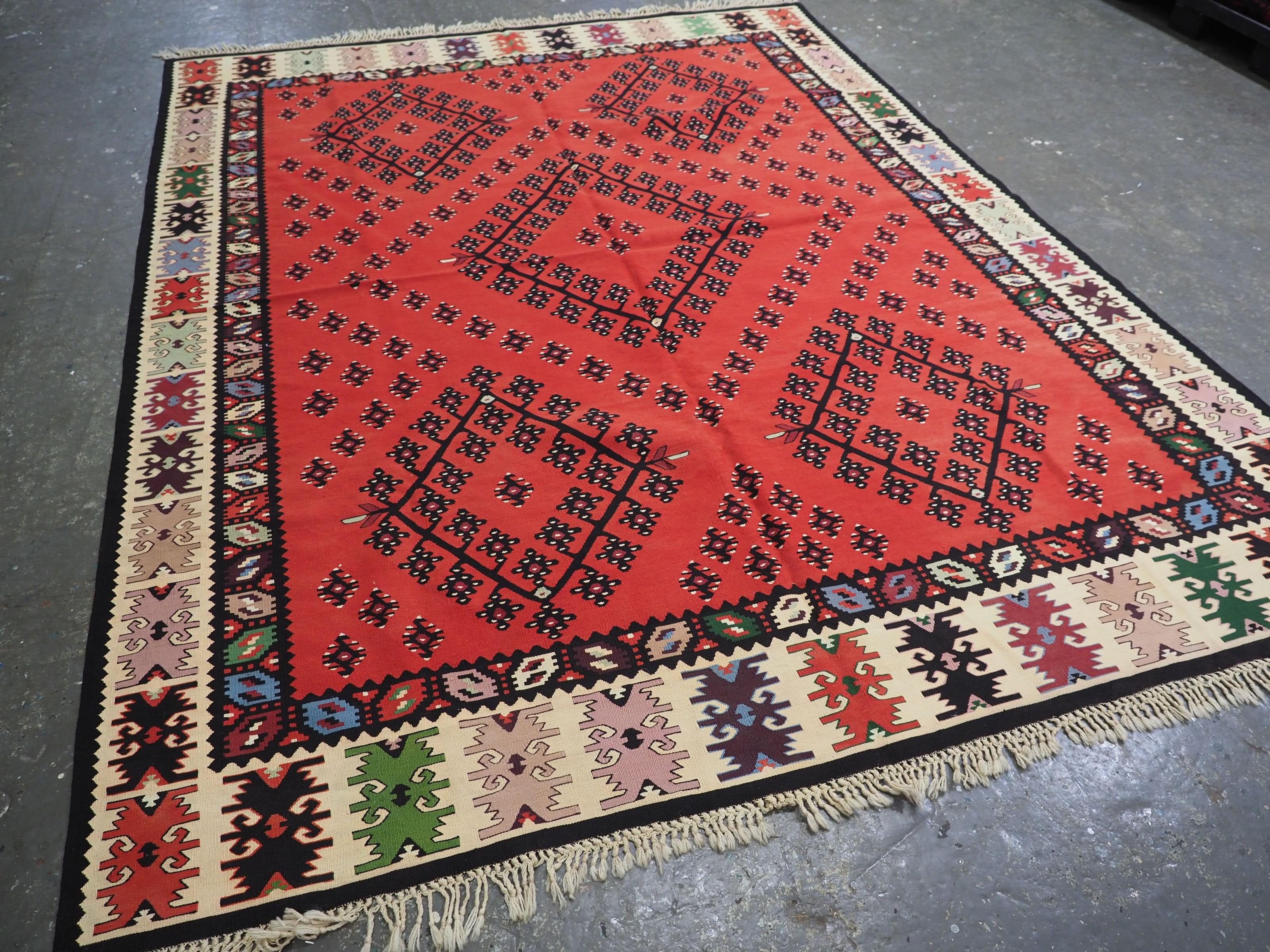 Size: 9ft 9in x 7ft 7in (298 x 230cm).

Antique Pirot / Sarkoy kilim of traditional design. A kilim of good room size.

Circa 1920.

Pirot kilims are also known as Sarkoy or Sharkoy, they originate from the town of Pirot in south-eastern Serbia;