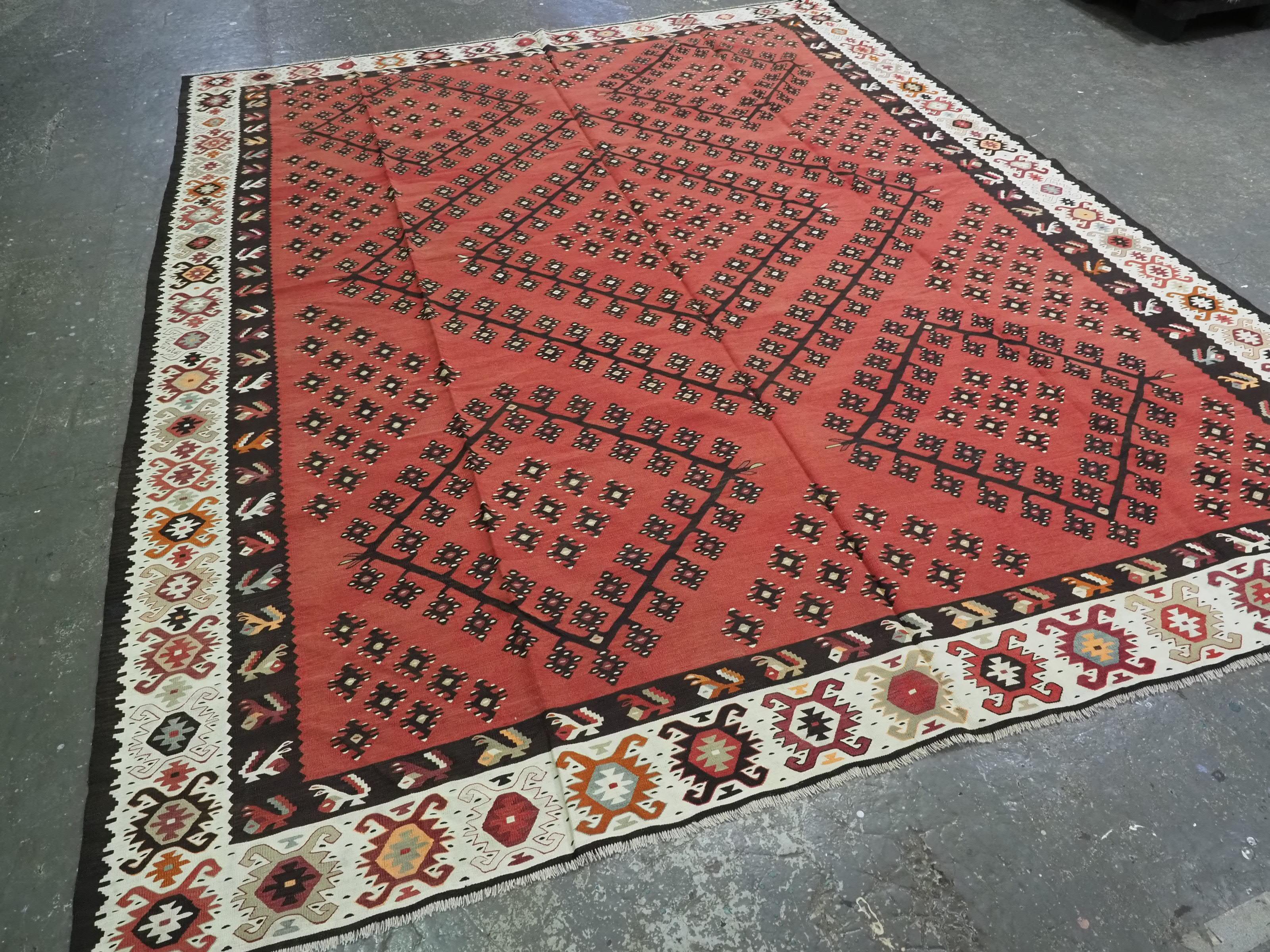 
Size: 11ft 1in x 9ft 0in (338 x 274cm).

Antique Pirot / Sarkoy kilim of traditional design. A kilim of large room size.

Circa 1920.

Pirot kilims are also known as Sarkoy or Sharkoy, they originate from the town of Pirot in south-eastern Serbia;