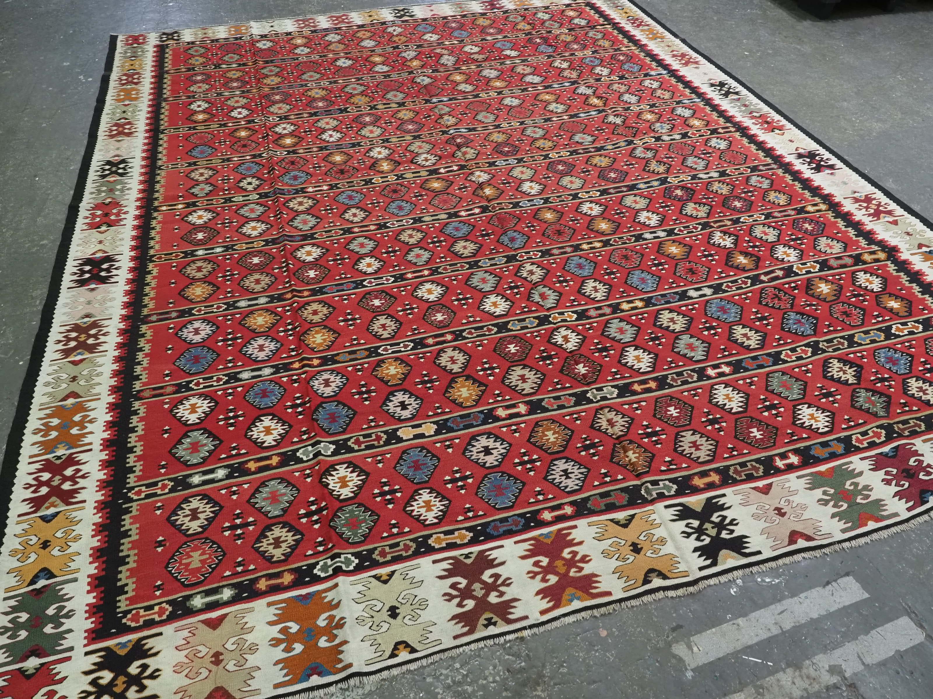 
Size: 11ft 0in x 9ft 1in (335 x 276cm).

Antique Pirot / Sarkoy kilim of traditional fine banded design. A kilim of large room size.

Circa 1920.

Pirot kilims are also known as Sarkoy or Sharkoy, they originate from the town of Pirot in