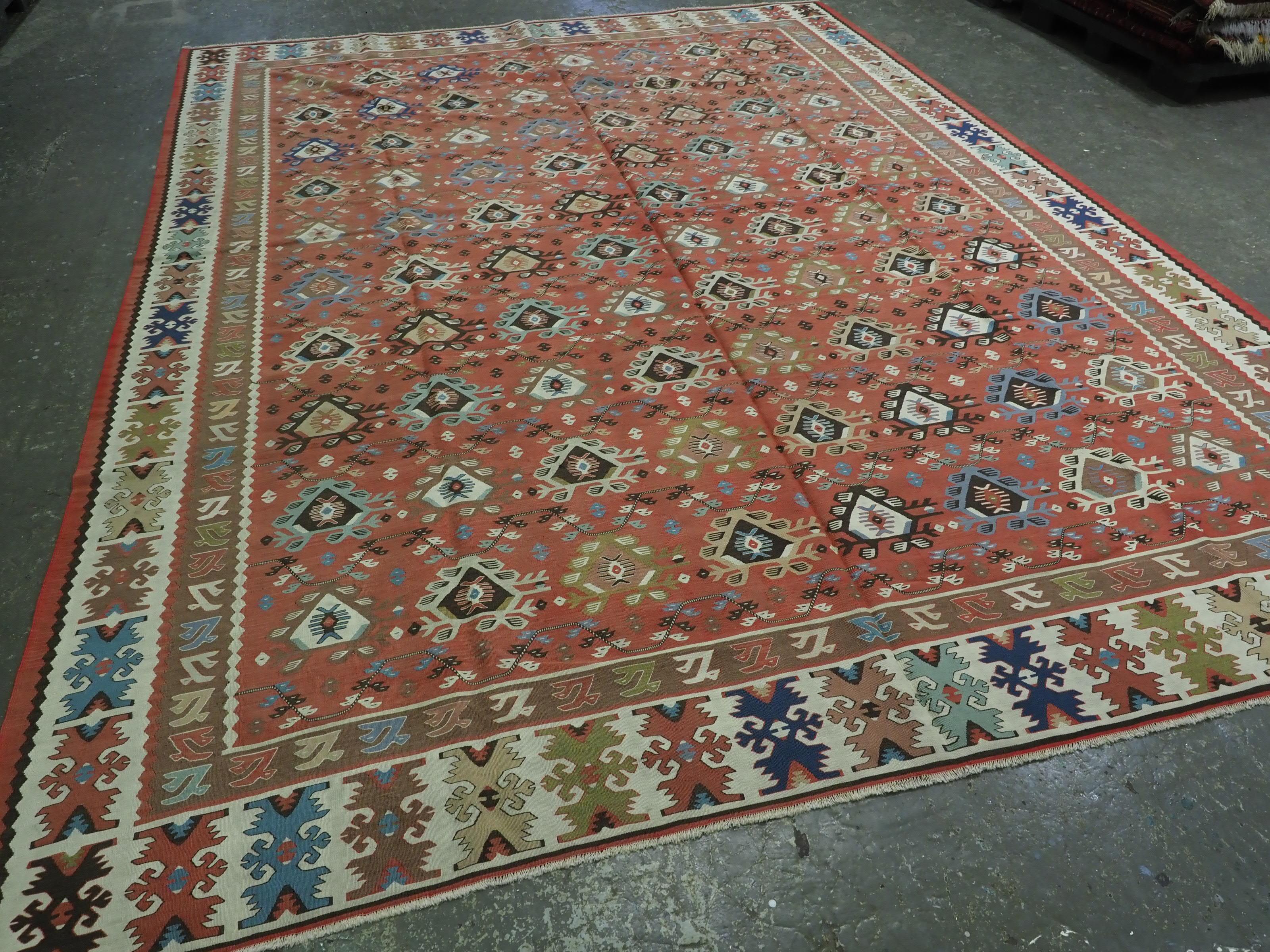 Size: 13ft 0in x 9ft 7in (397 x 292cm).

Antique Pirot / Sarkoy kilim of traditional repeat design. A kilim of large room size with outstanding colour.

Circa 1920.

Pirot kilims are also known as Sarkoy or Sharkoy, they originate from the town of