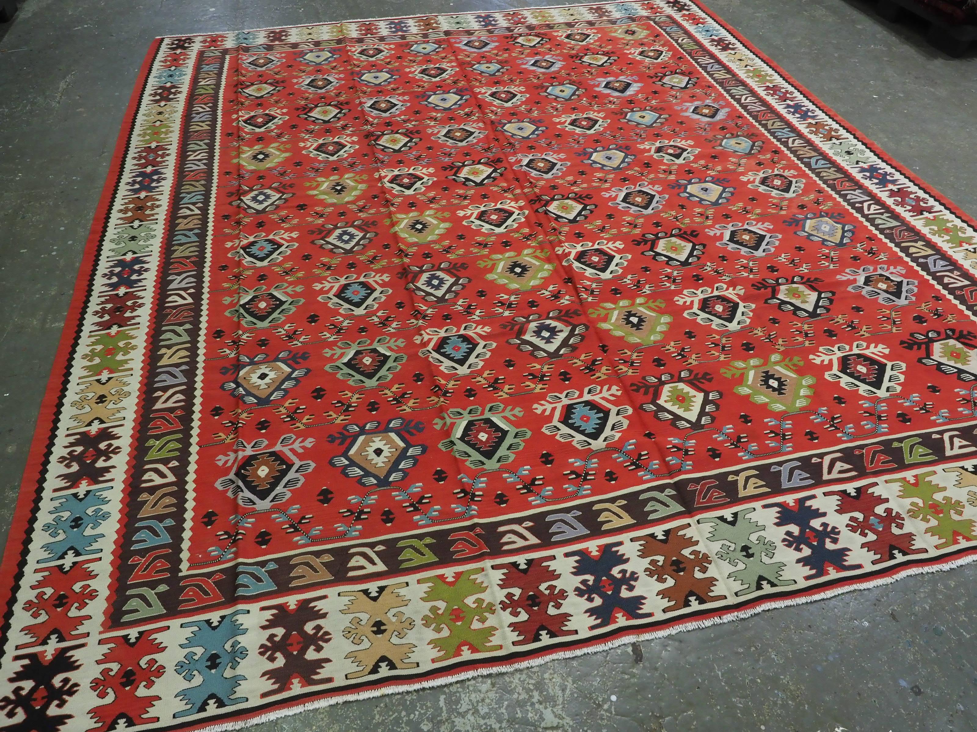 
Size: 11ft 6in x 9ft 8in (350 x 295cm).

Antique Pirot / Sarkoy kilim of traditional repeat design. A kilim of large room size.

Circa 1920.

Pirot kilims are also known as Sarkoy or Sharkoy, they originate from the town of Pirot in south-eastern
