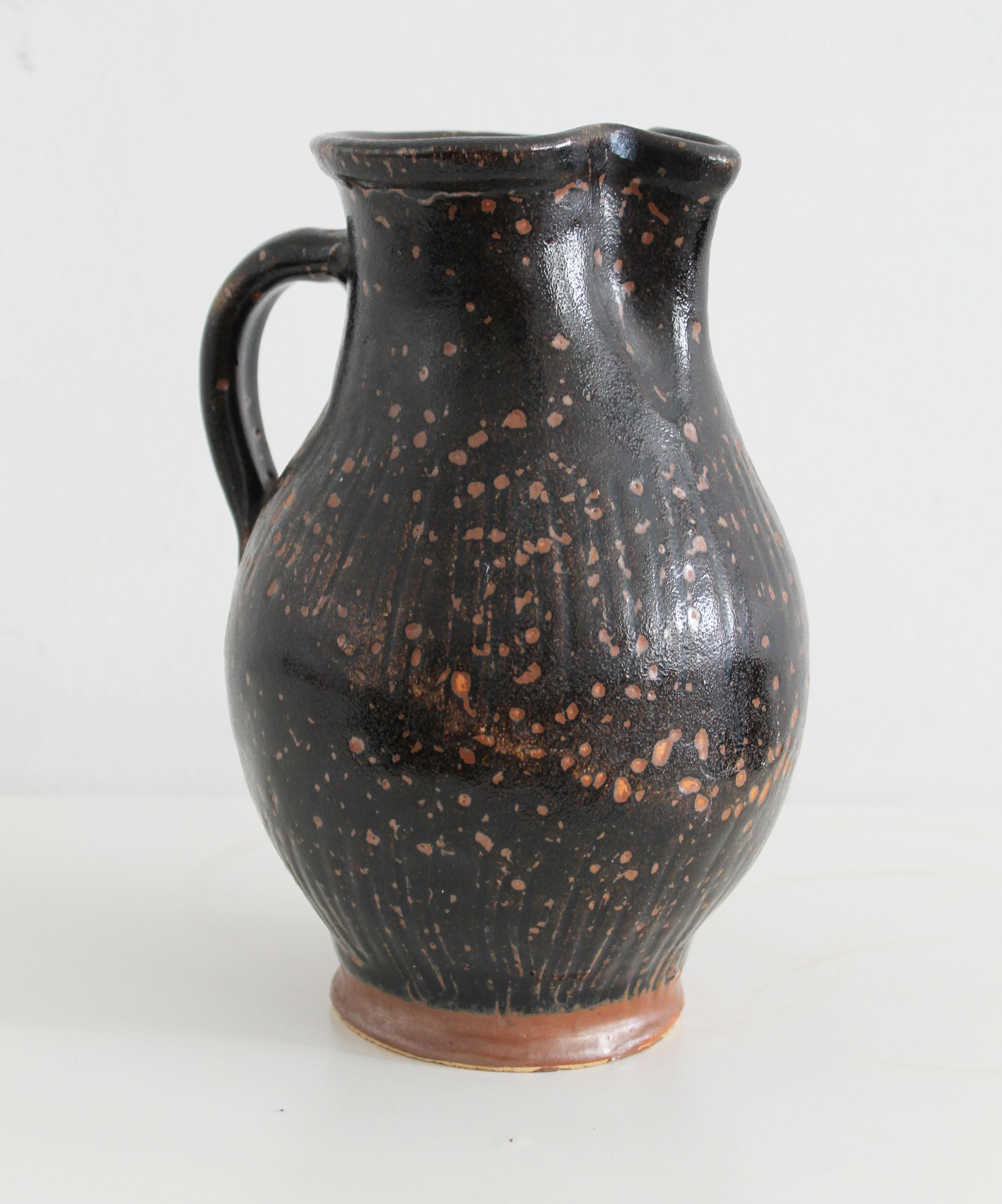 Antique pitcher made of dark glazed stoneware For Sale 2